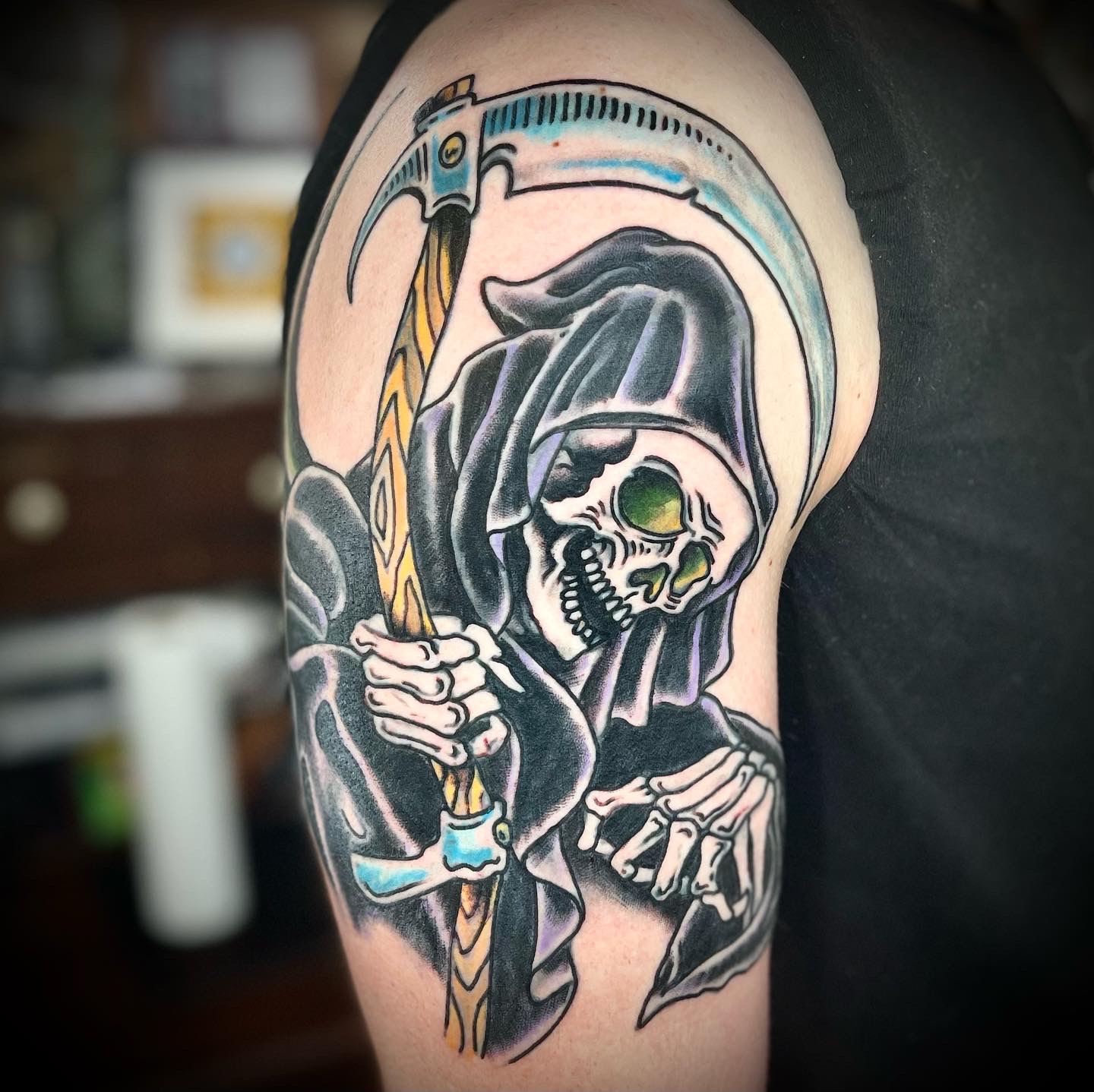 Tattoo of the grim reaper on a mans arm from Dallas tattoo artist