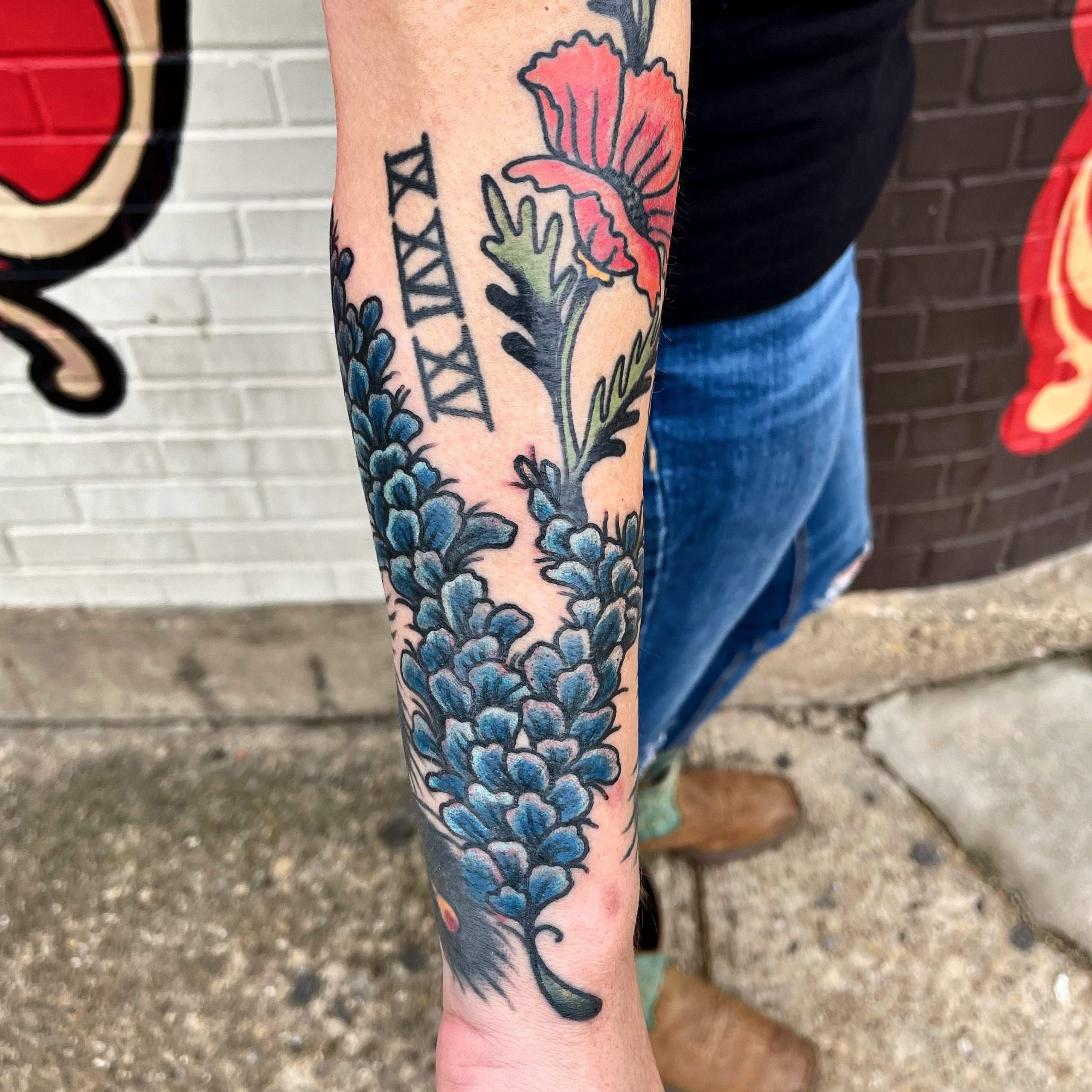 blue flower tattoo from top tattoo artists in dallas