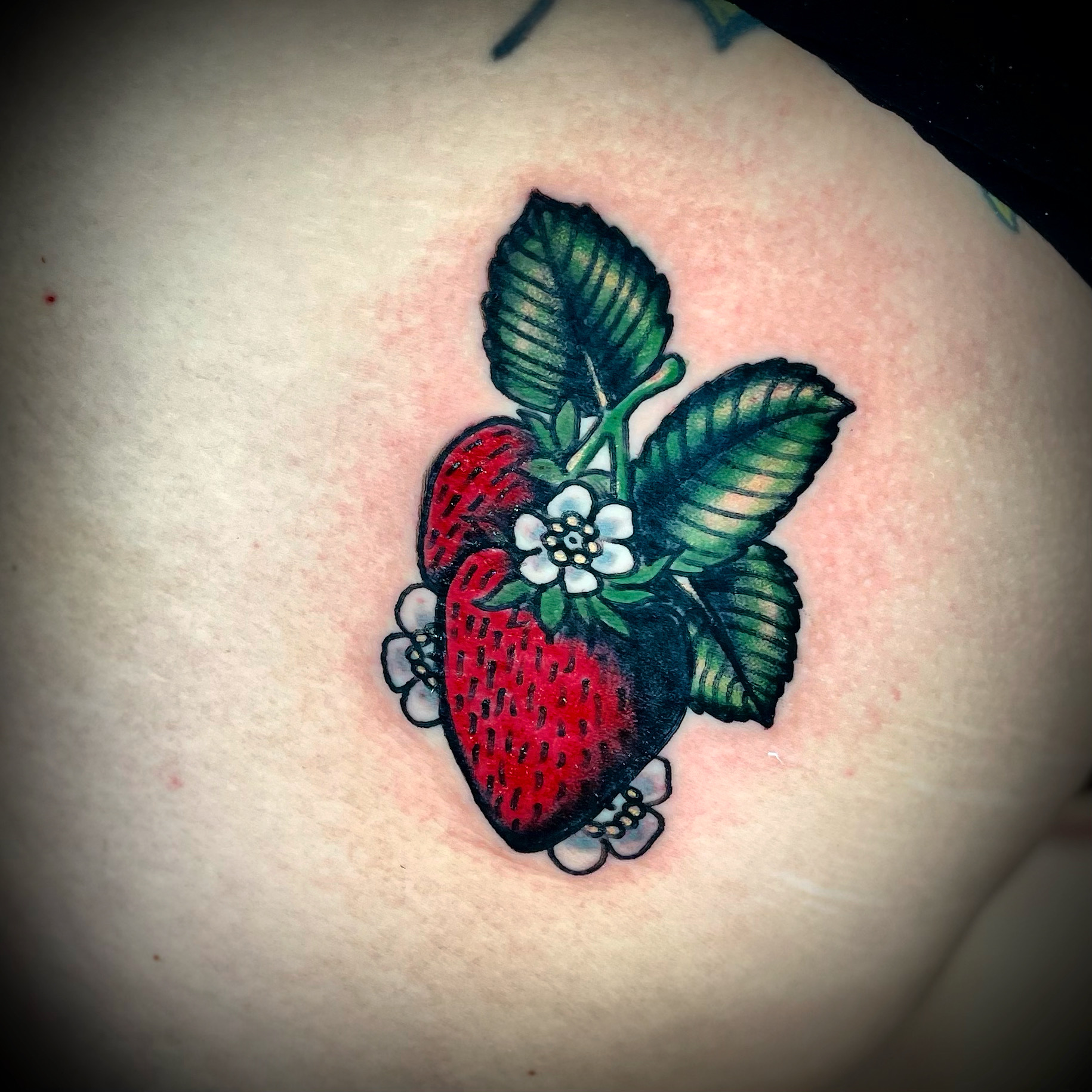 Tattoo of a strawberry
