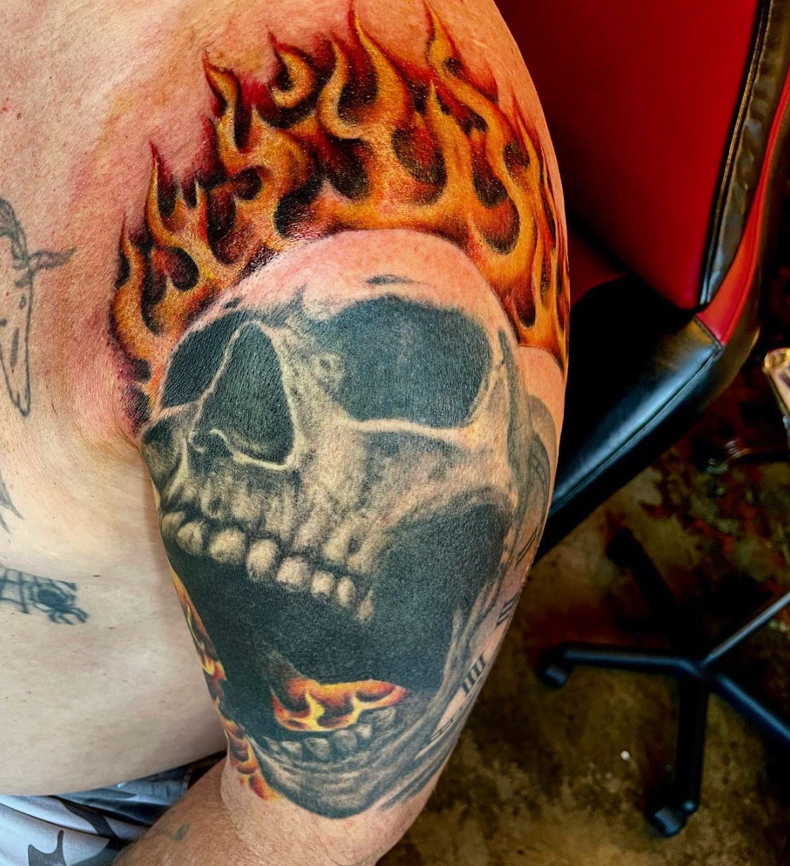 tattoo of a fiery skull from top tattoo artists in dallas