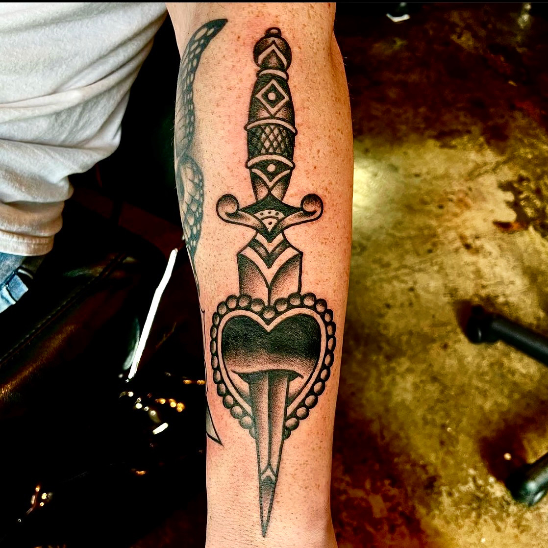 Tattoo of a knife and a heart