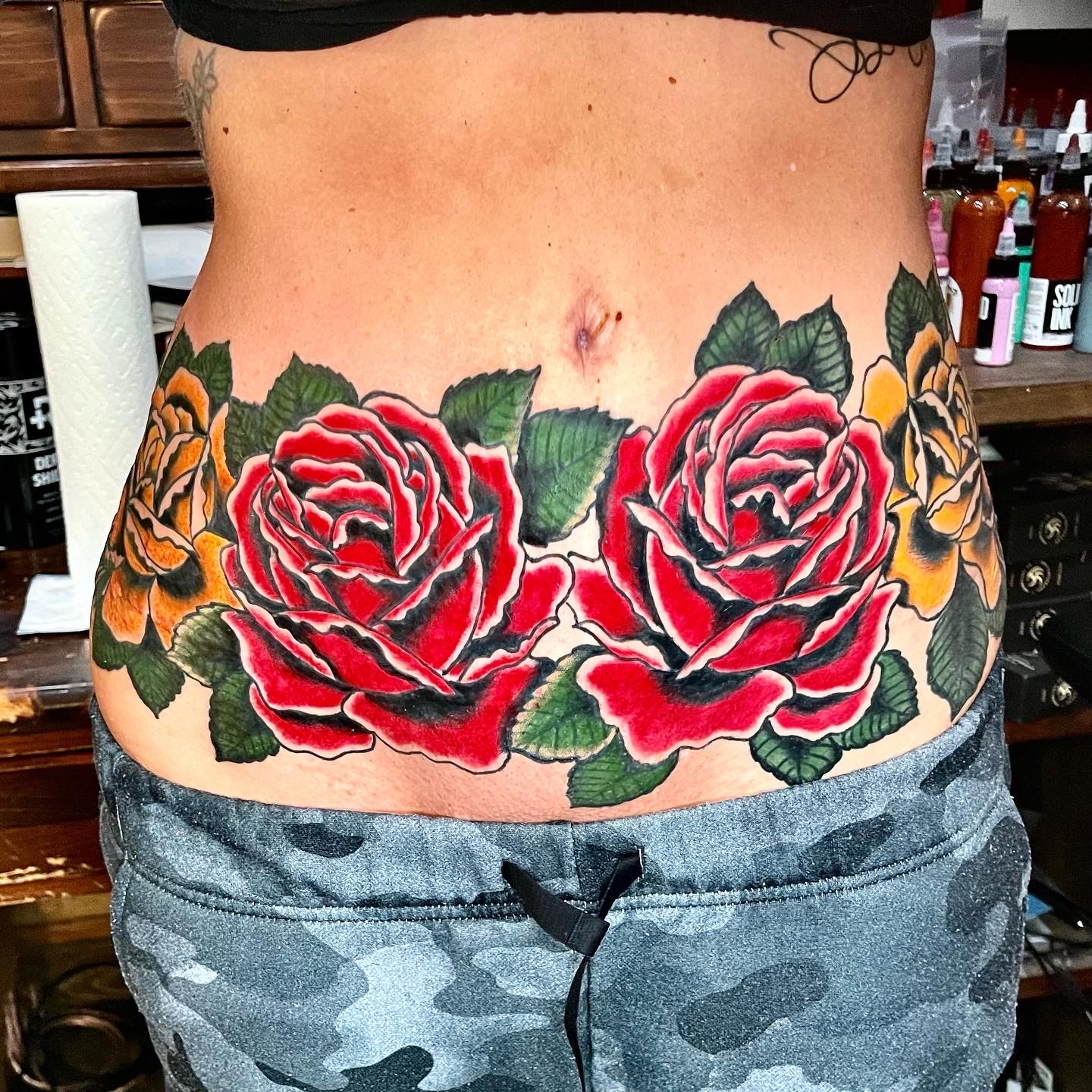 Tattoo of red and yellow roses
