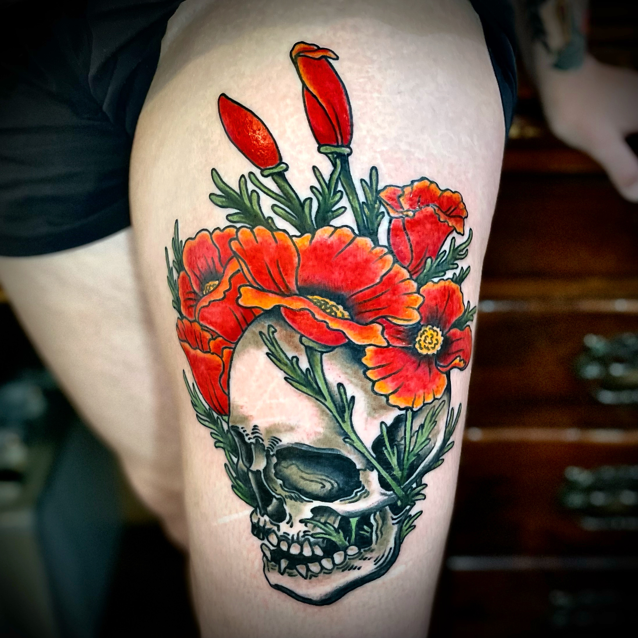Tattoo of a skull and flowers