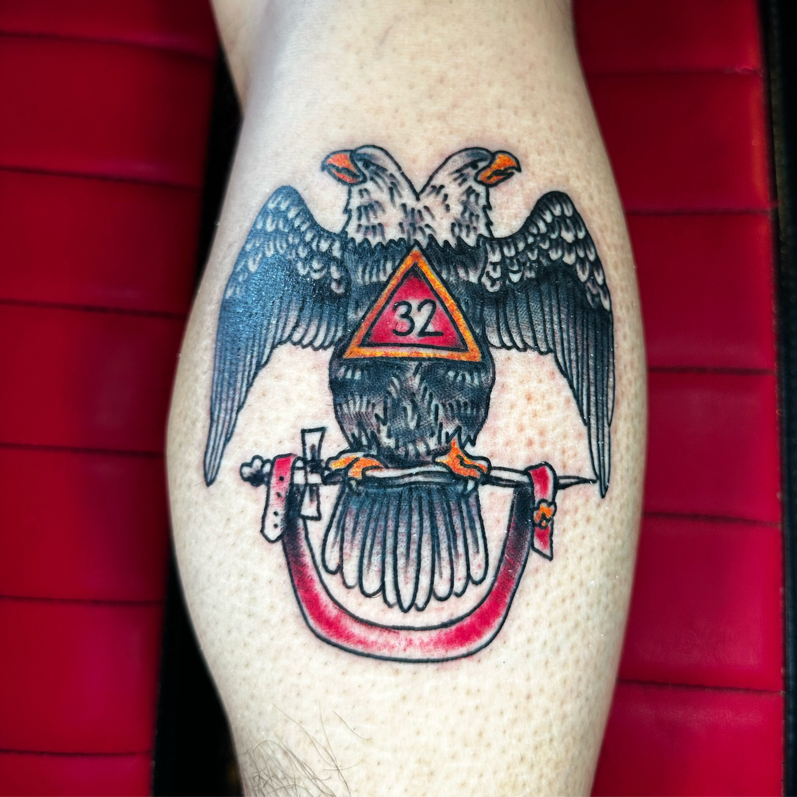 Tattoo of an eagle and a sword
