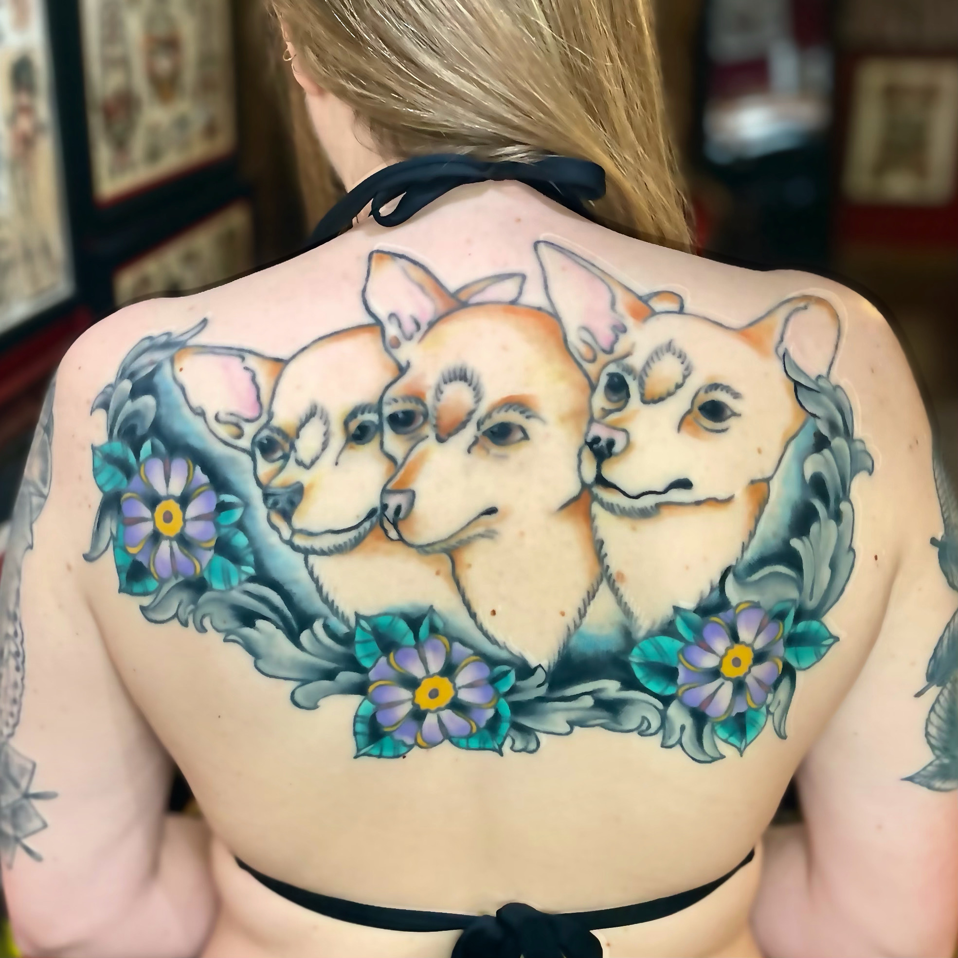 Back tattoo of dogs from top tattoo artists in dallas