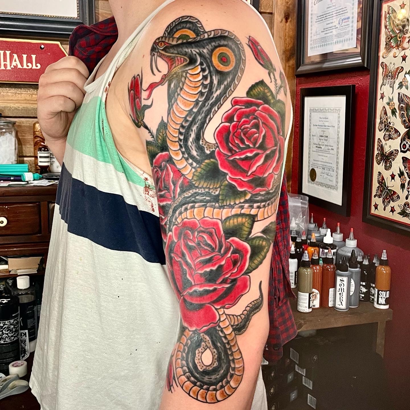 tattoo of flowers and a snake from top tattoo artists in dallas