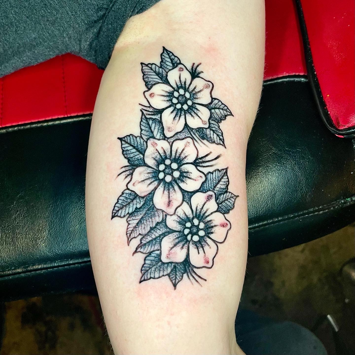 tattoo of three flowers from the top tattoo artist in Dallas Texas