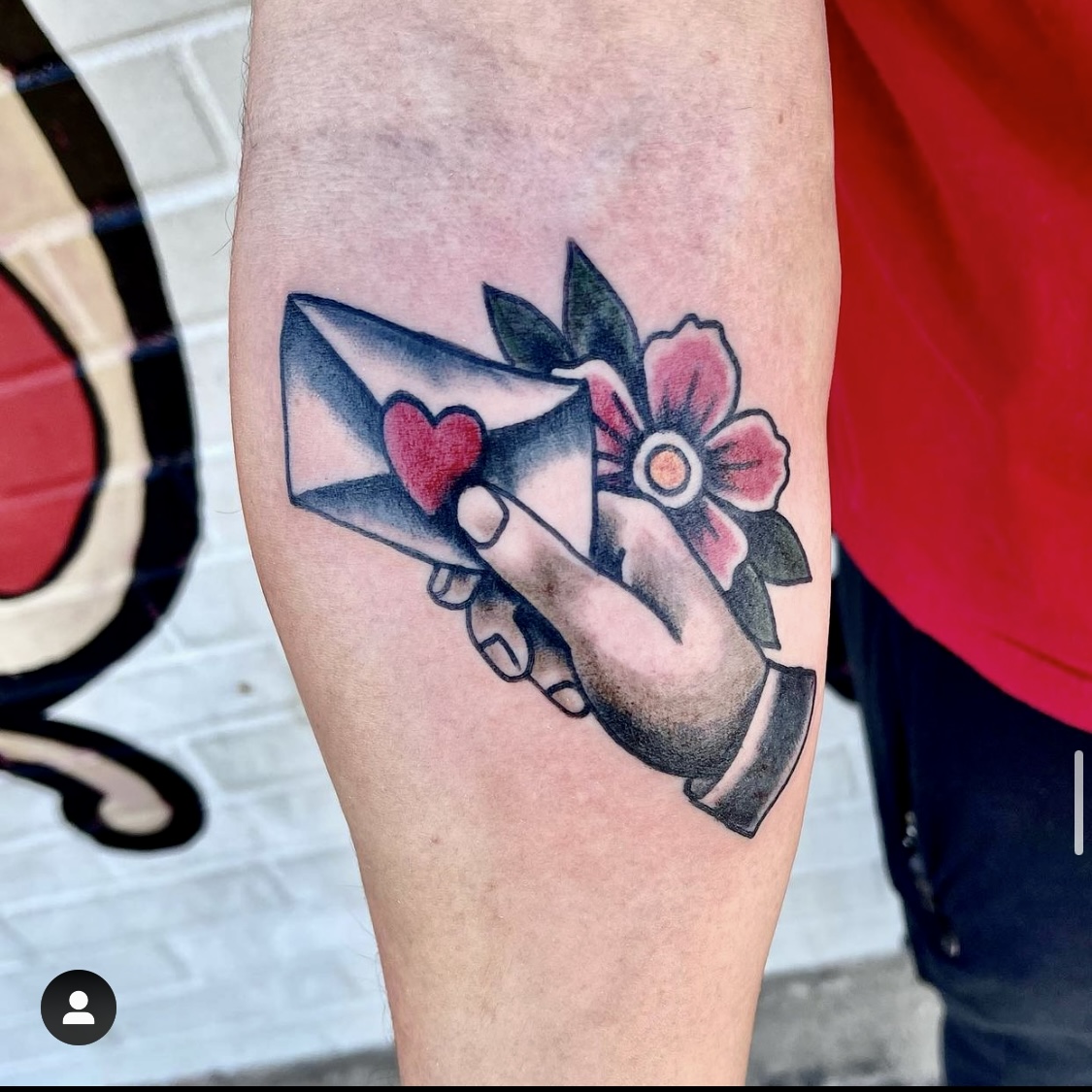 Tattoo of a hand with a letter in it from Dallas Tattoo artist