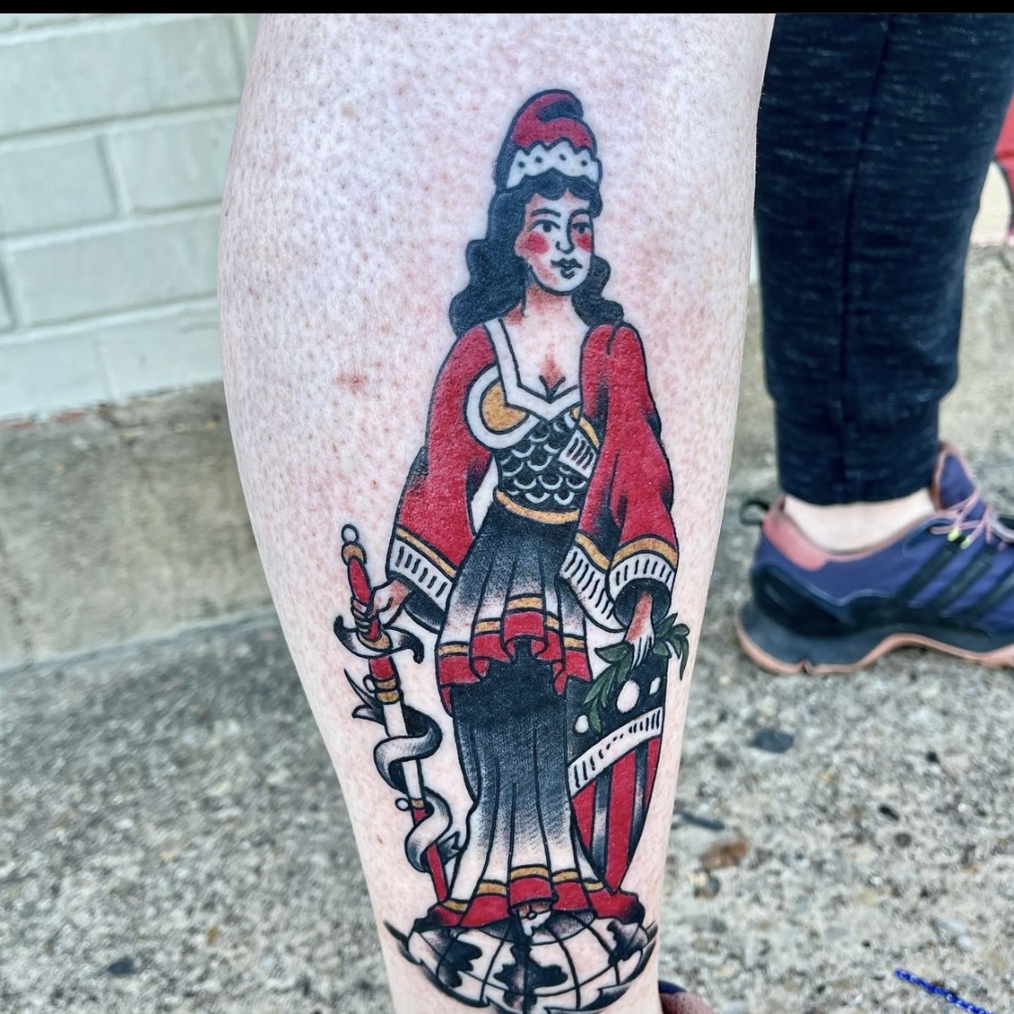 Tattoo of a woman with a sword from best tattoo shop in dallas texas