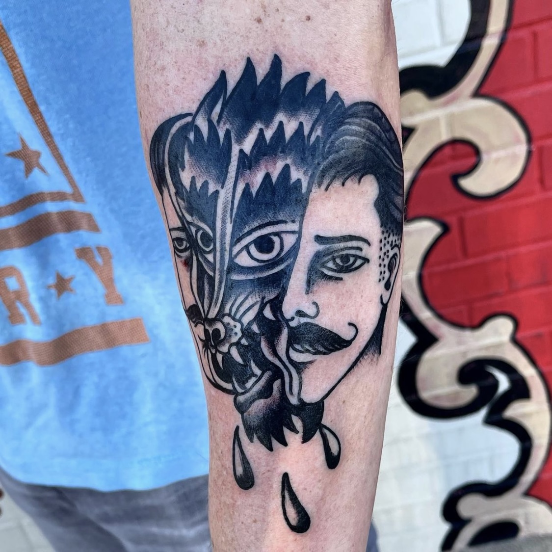 Black tattoo of a wolf and man from best tattoo shops in dallas tx