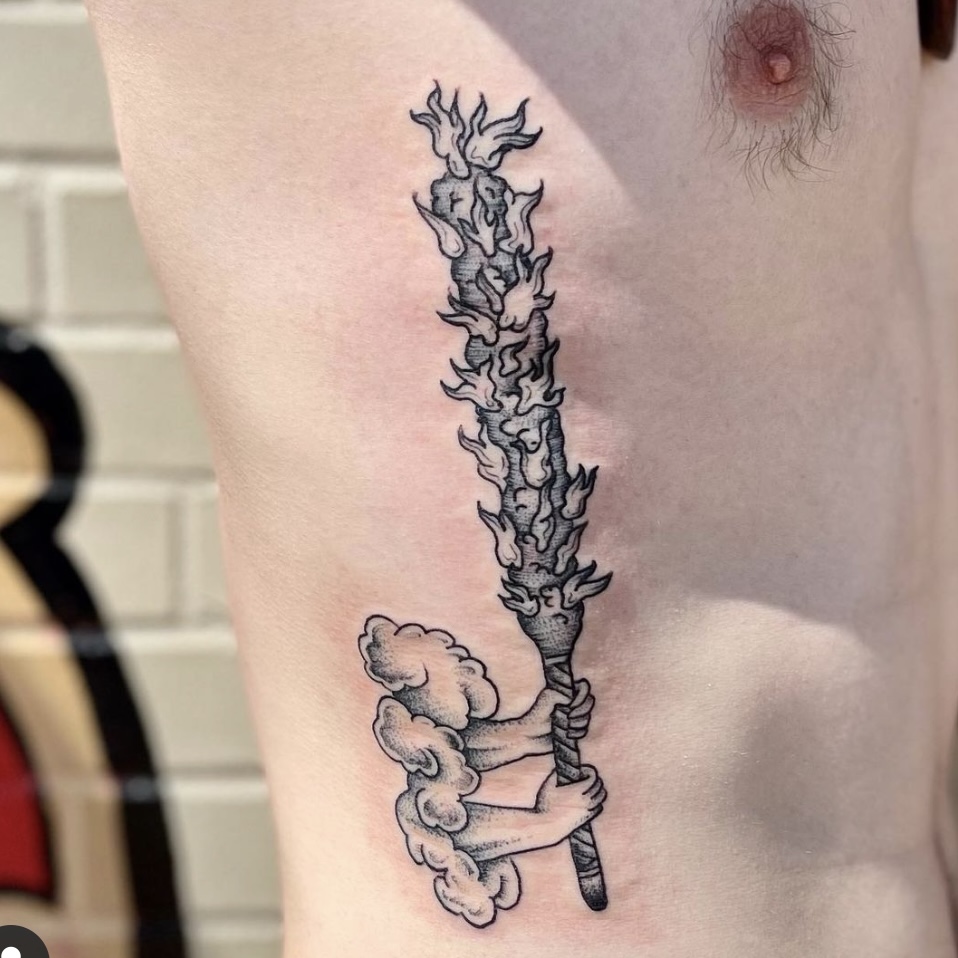 fiery sword tattoo from dallas tattoo shop