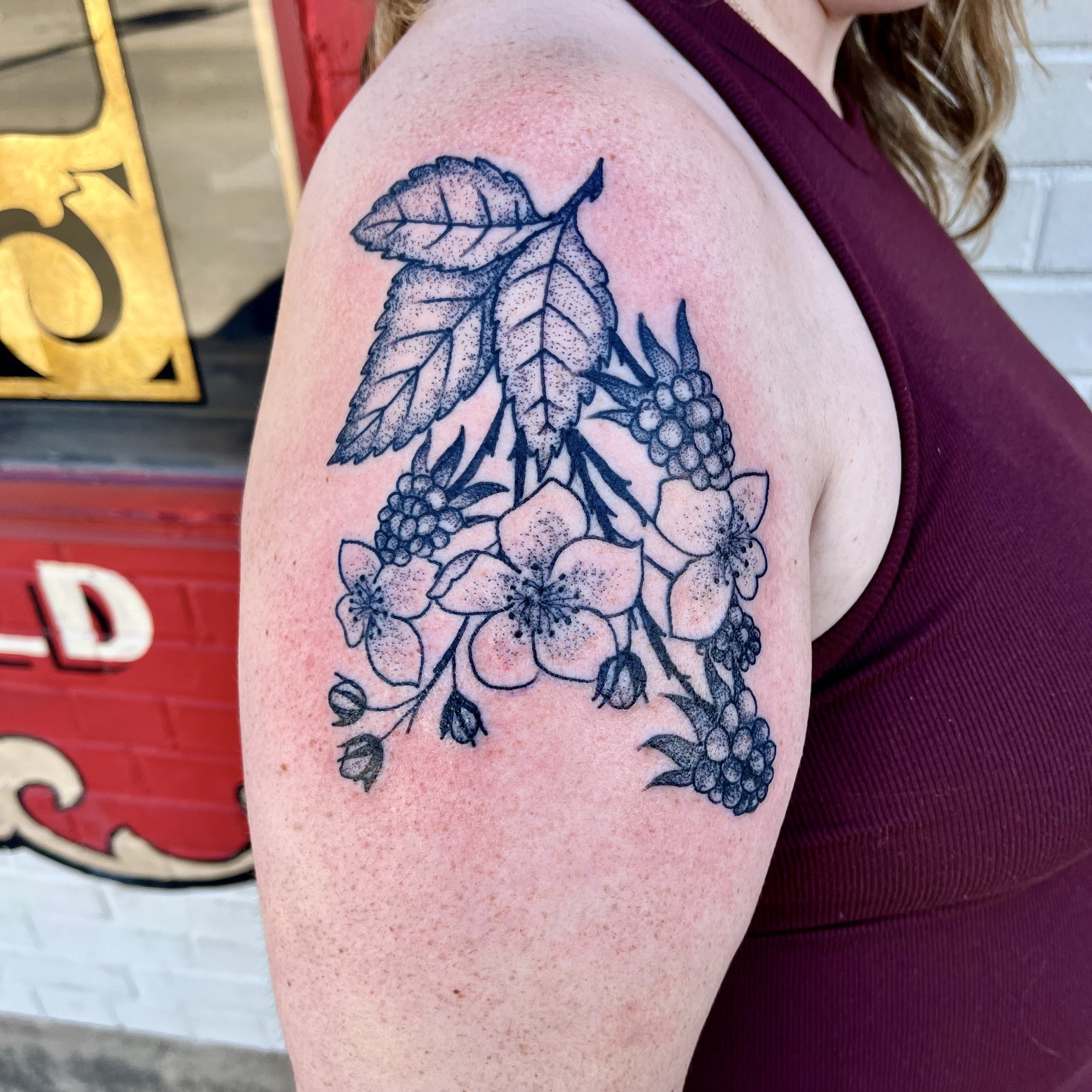 tattoo of leaves and flowers from top tattoo artist in Dallas