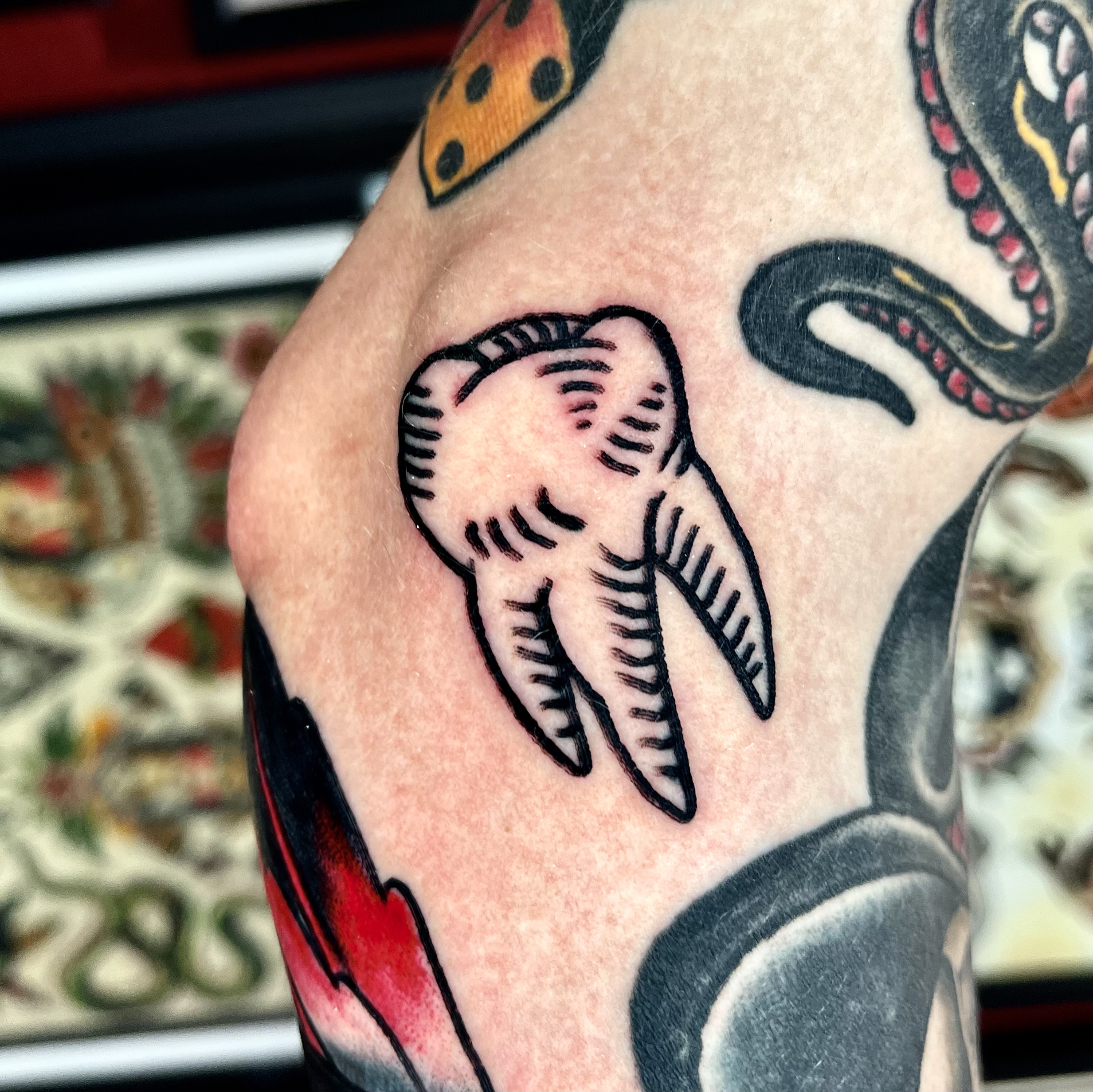 tattoo of a tooth from professional tattoo artist in Dallas TX
