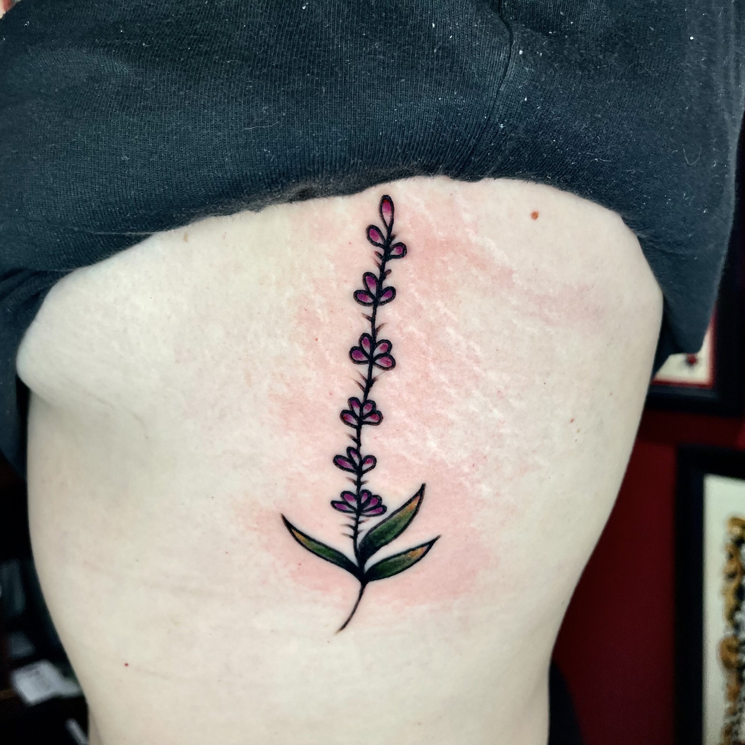 small tattoo of a flower from best cover up tattoo artist in dallas