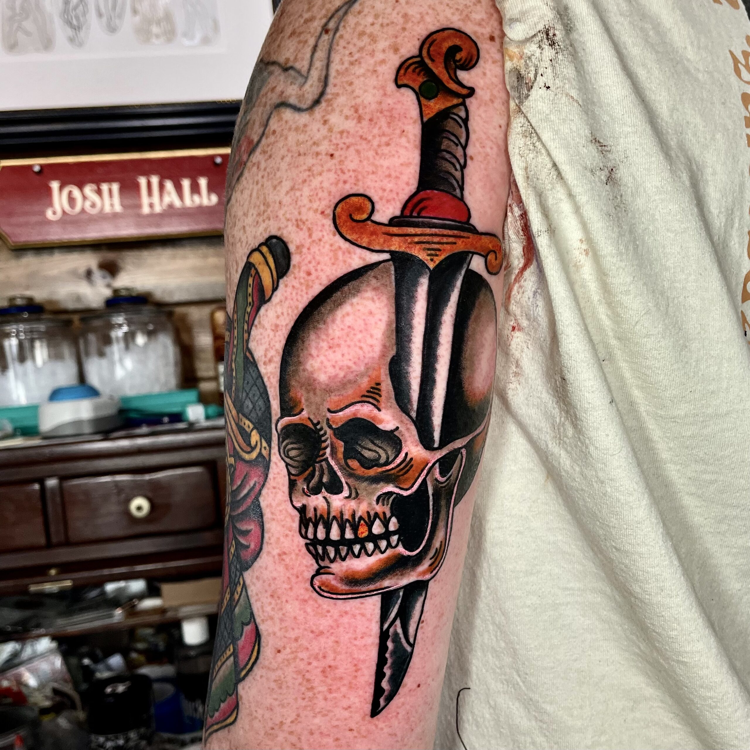 tattoo of a dagger and a skull from best tattoo in dallas texas