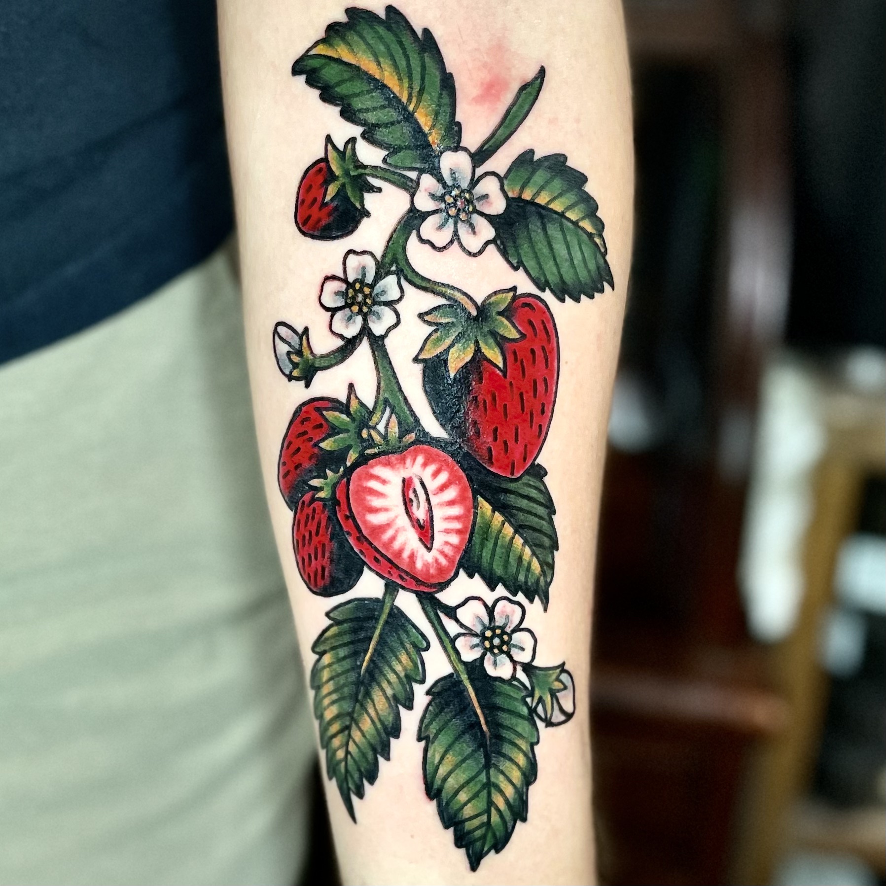 tattoo of a strawberry plant from dallas tattoo artists