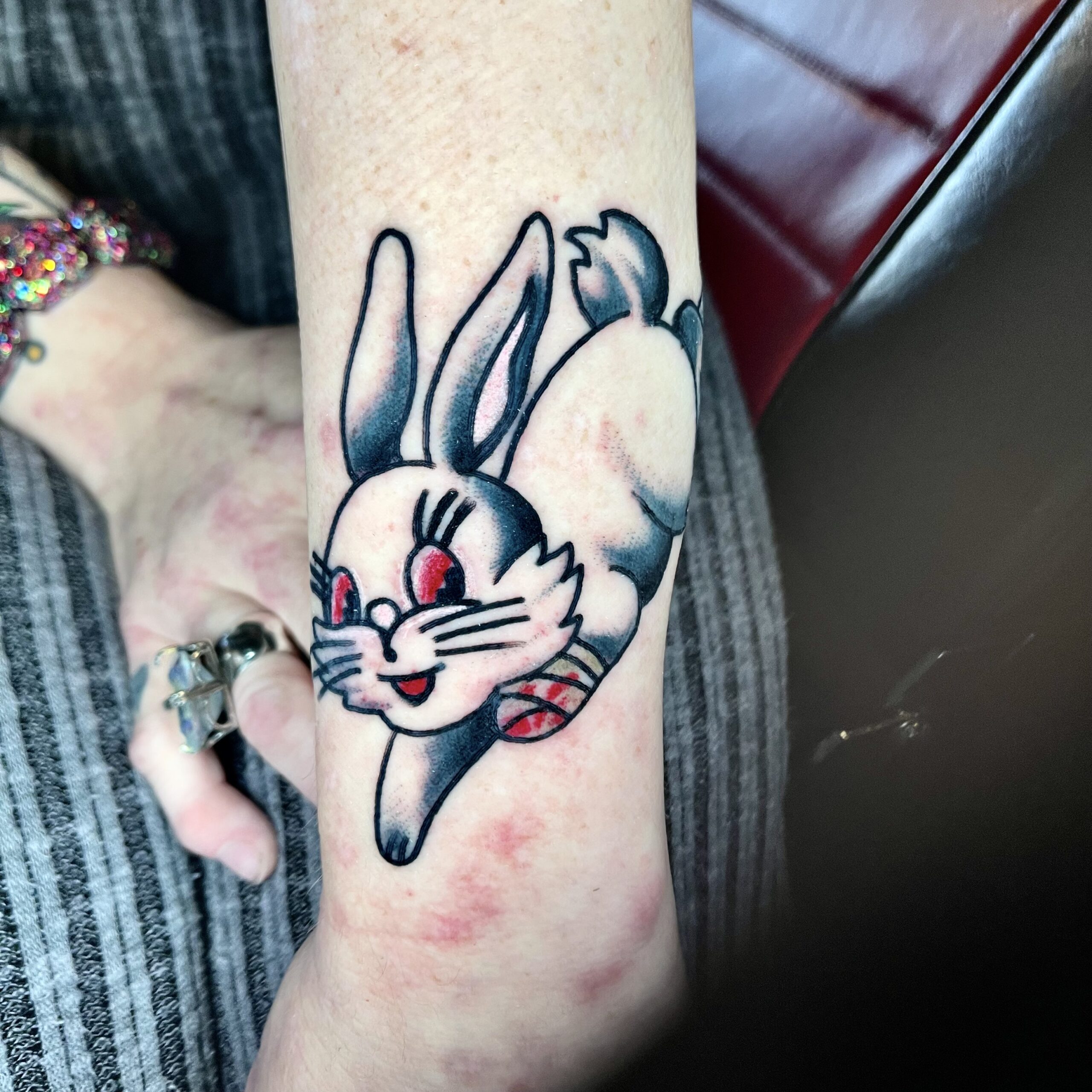 tattoo of a bunny on a woman's arm