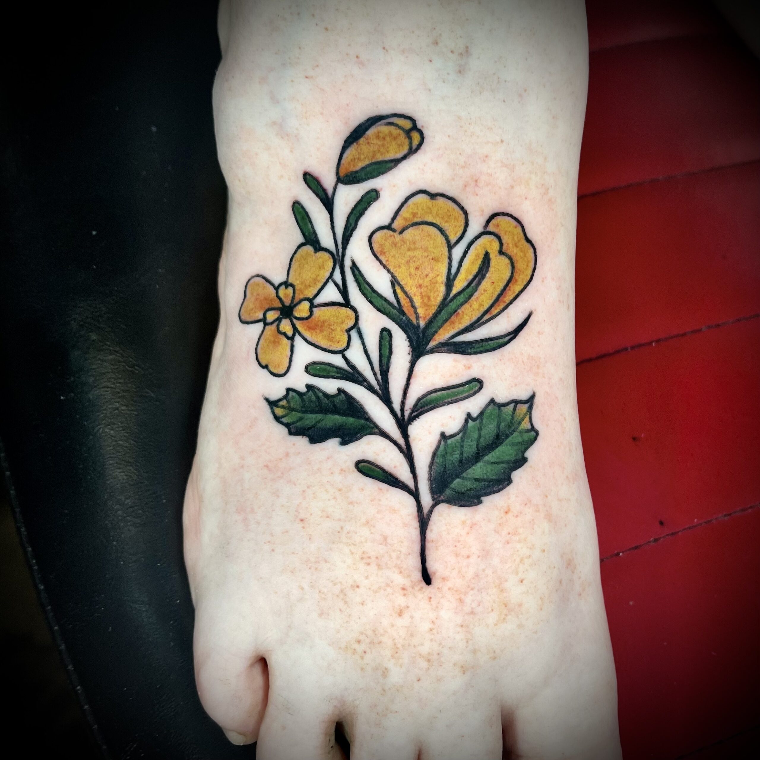 Tattoo of yellow flowers