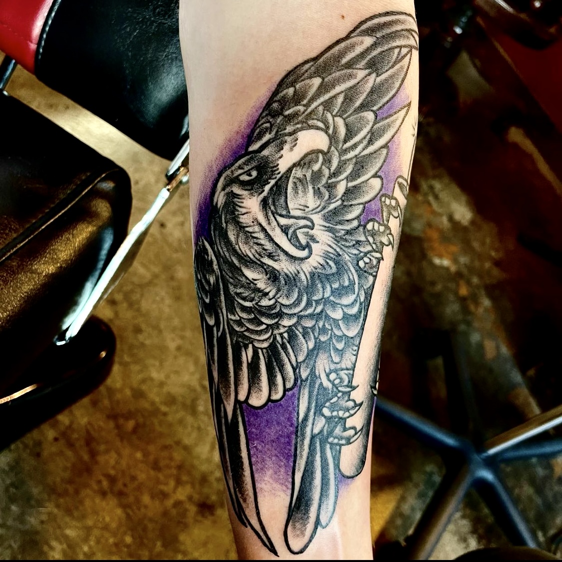 Tattoo of a black bird from Lamar Street Tattoo club