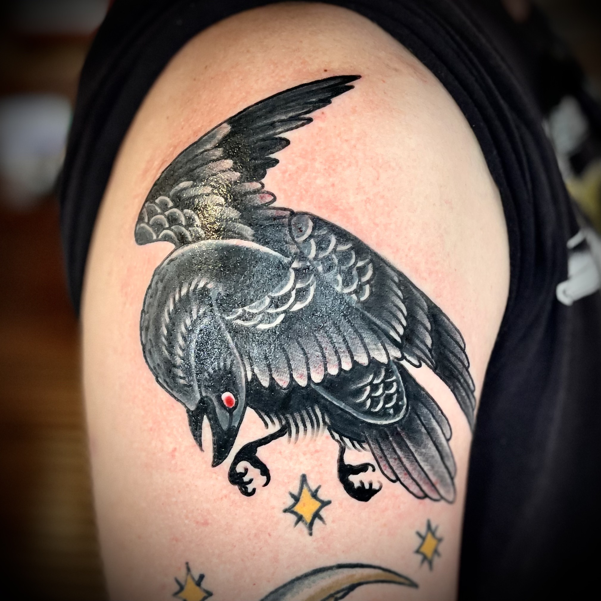 Tattoo of a blackbird from best tattoo shops in dallas tx