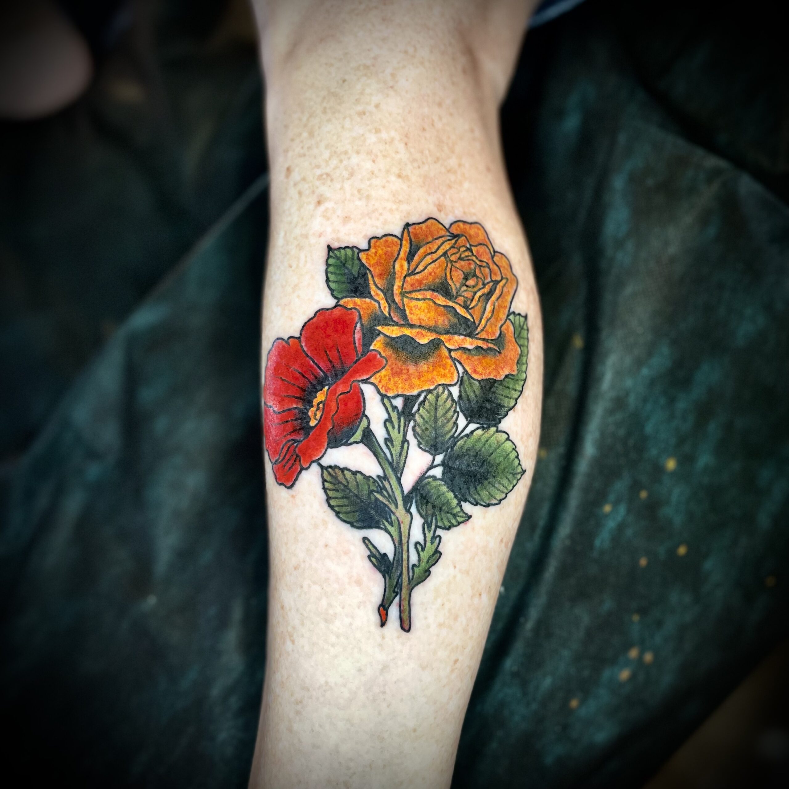 Tattoo of two flowers from top Dallas Texas tattoo artist