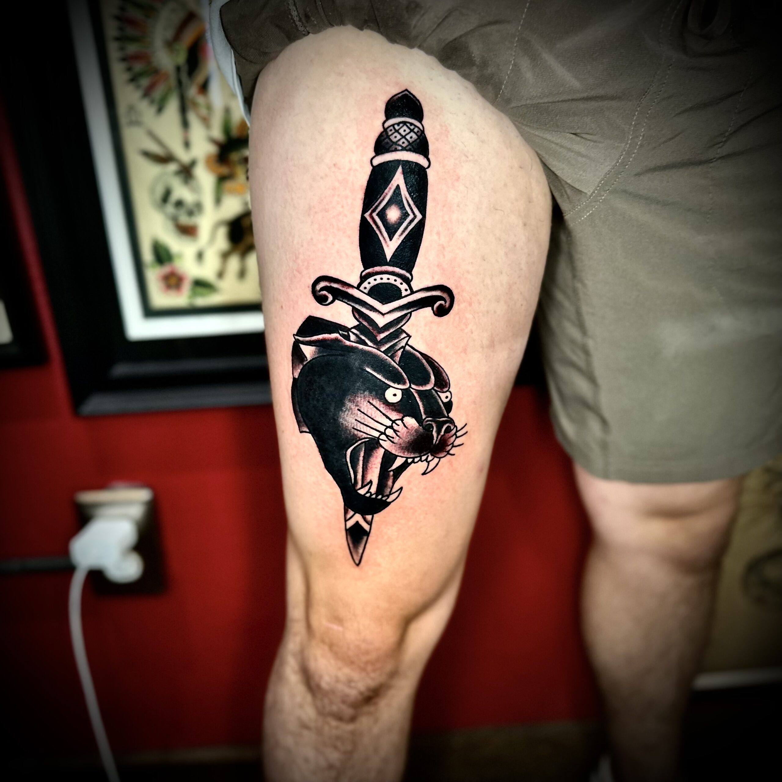 tattoo of a panther and a dagger
