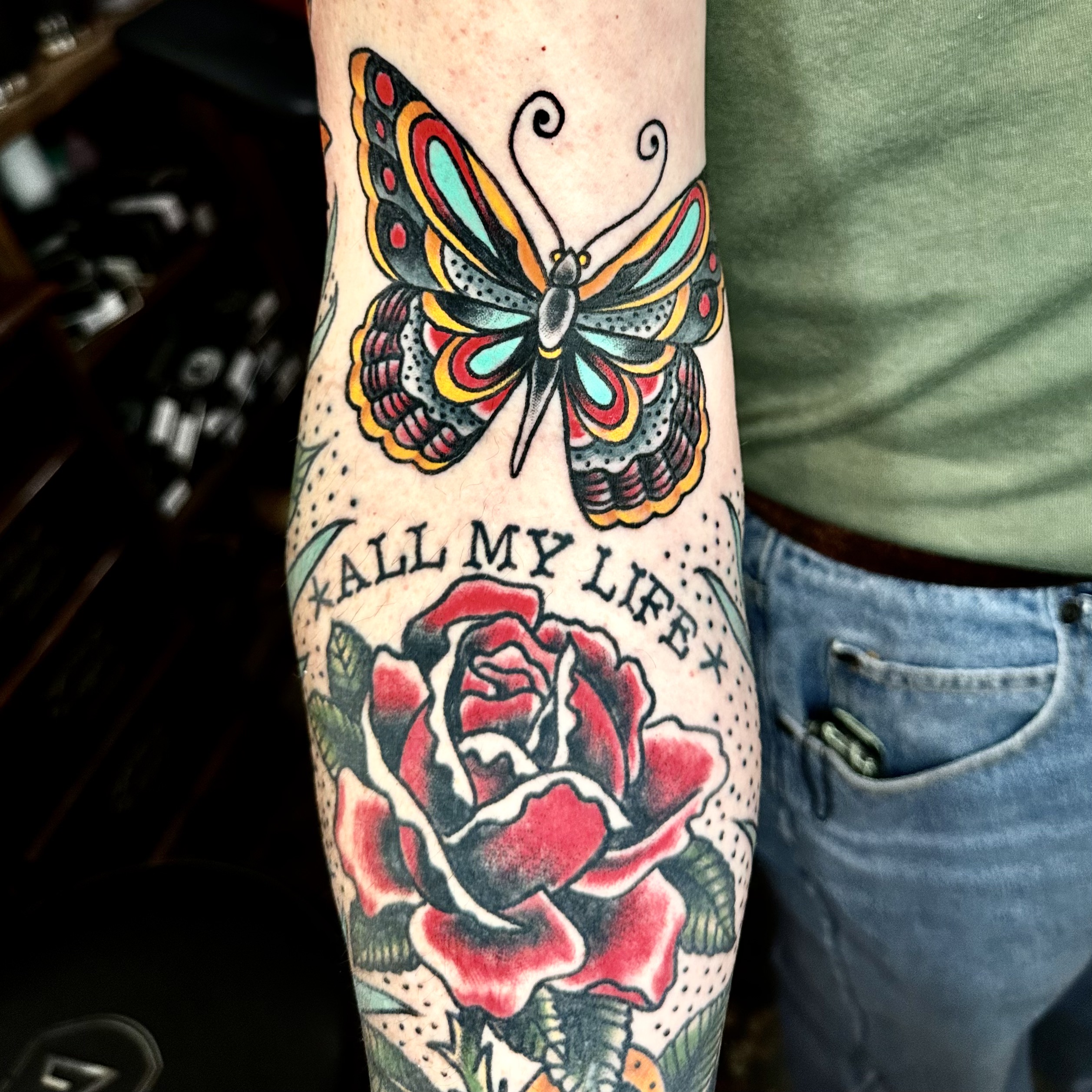 tattoo of a butterfly and a rose