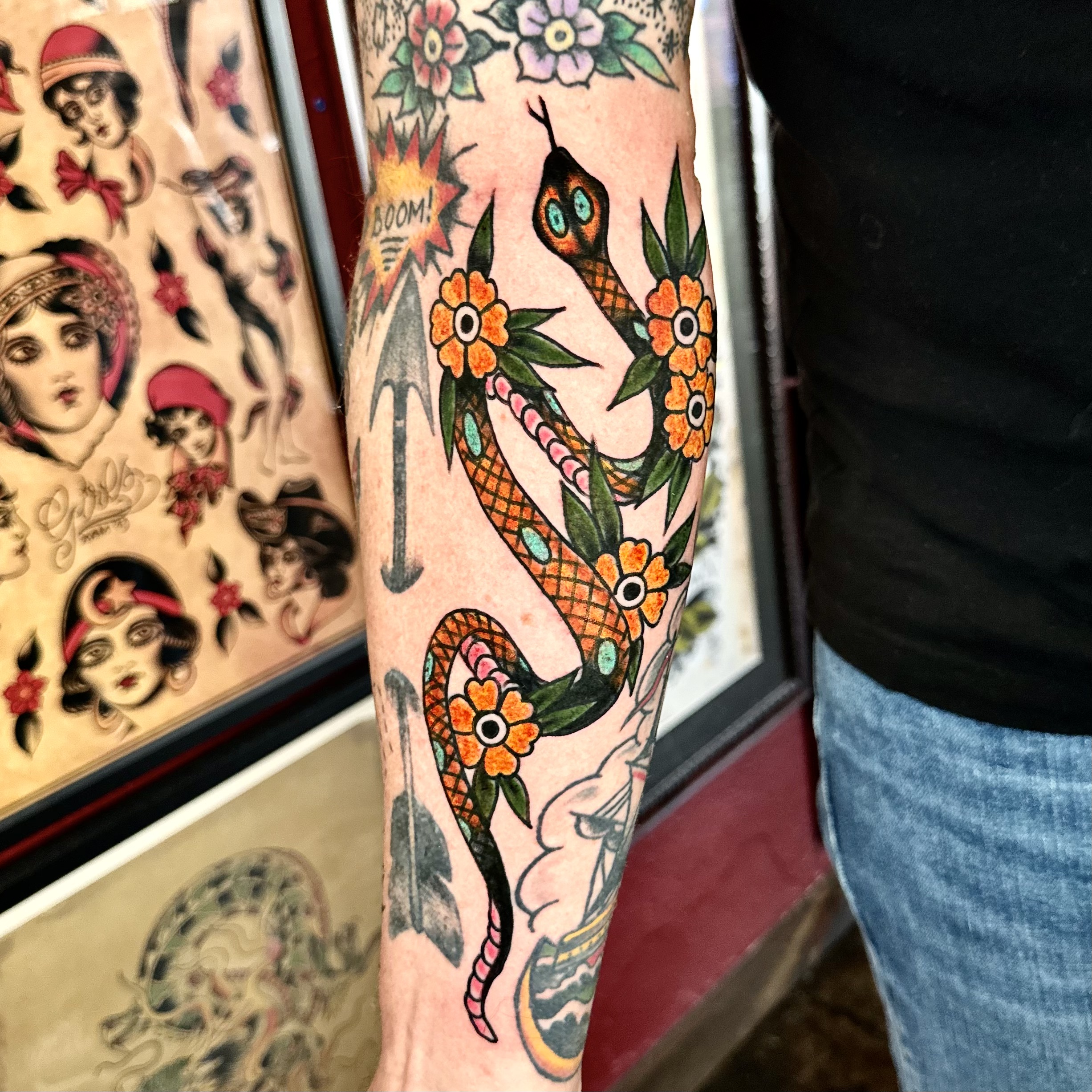 Tattoo of a snake and flowers