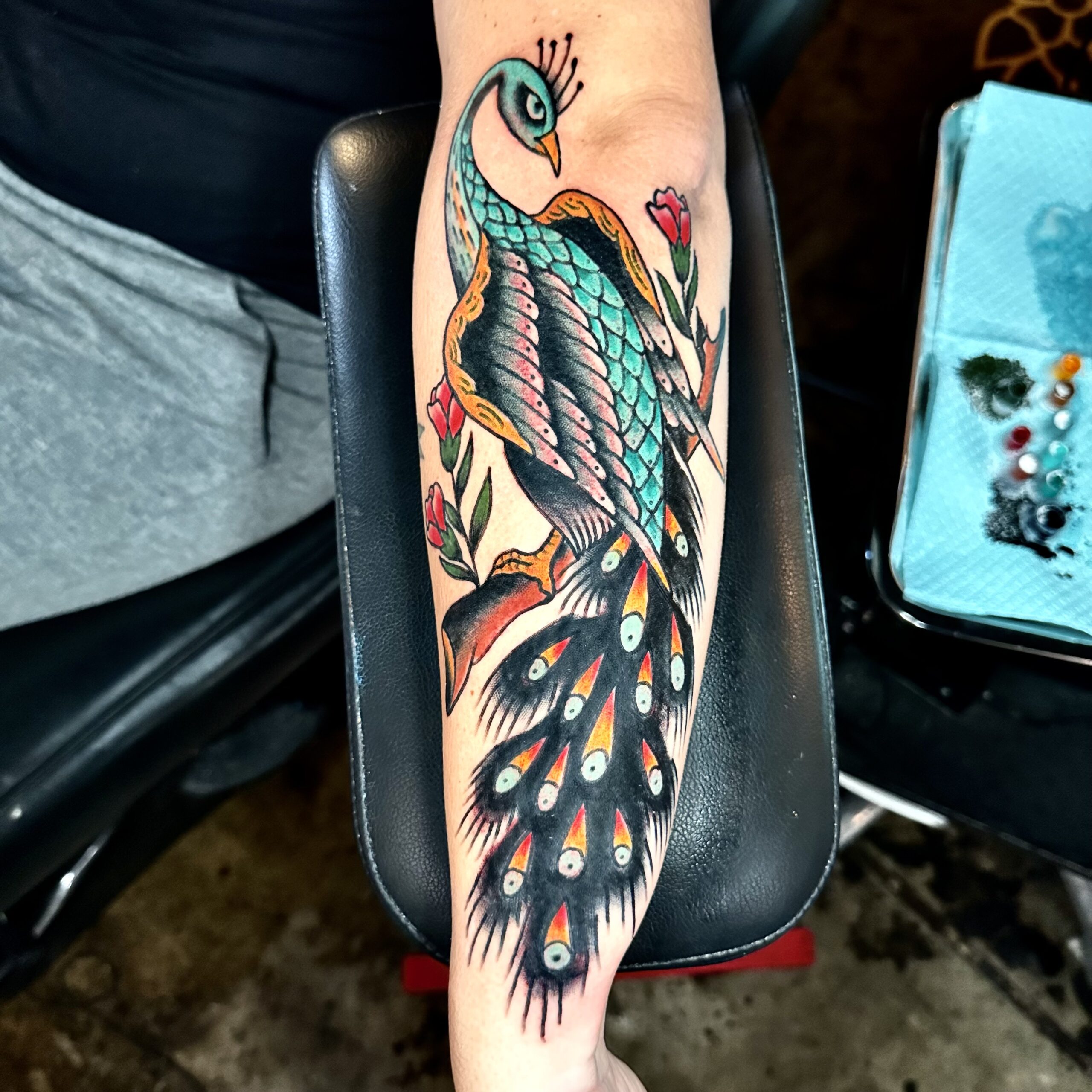 Tattoo of a peacock from top Dallas Tattoo artist