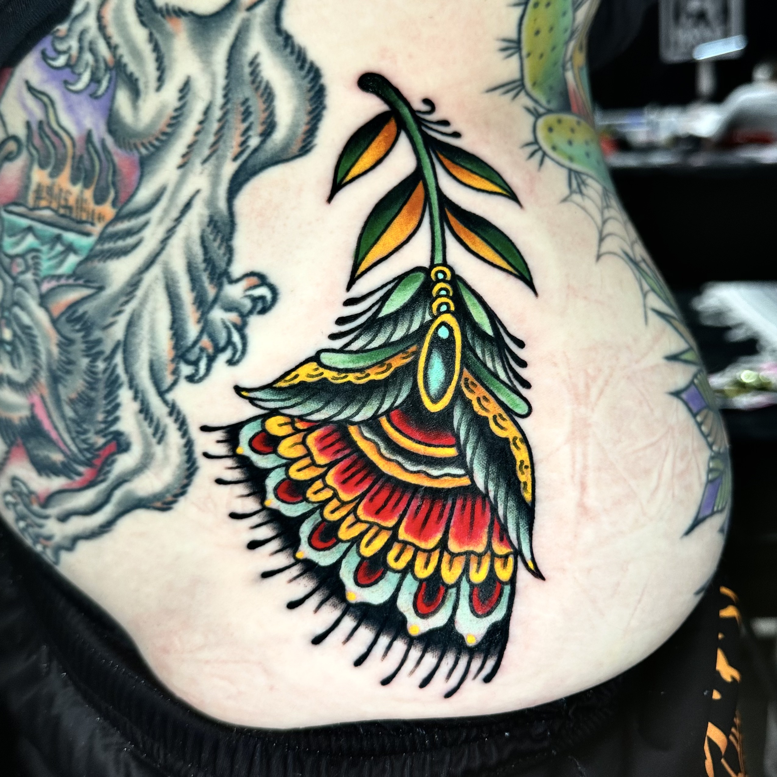 Tattoo of a feather flower