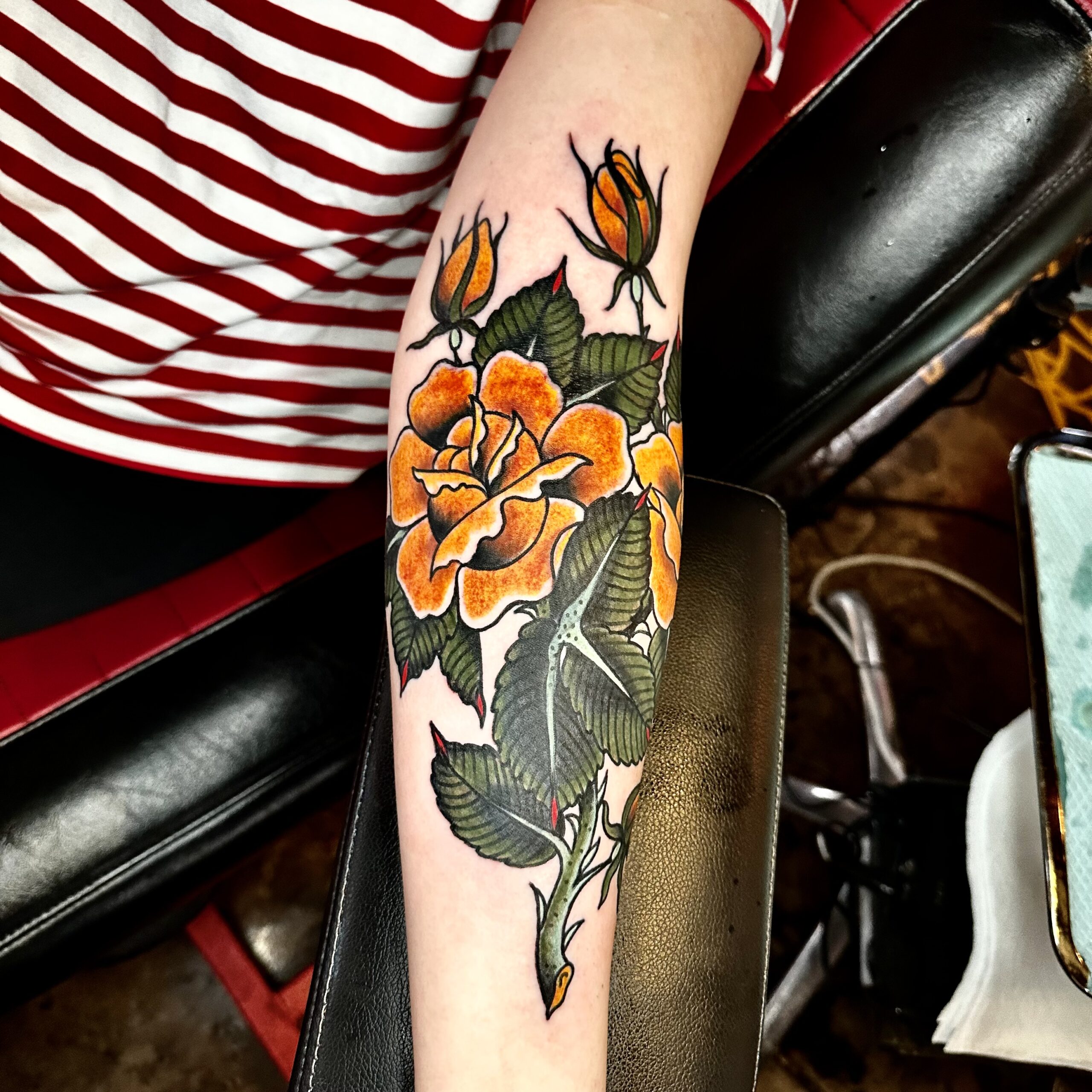 Tattoo of yellow and orange flowers