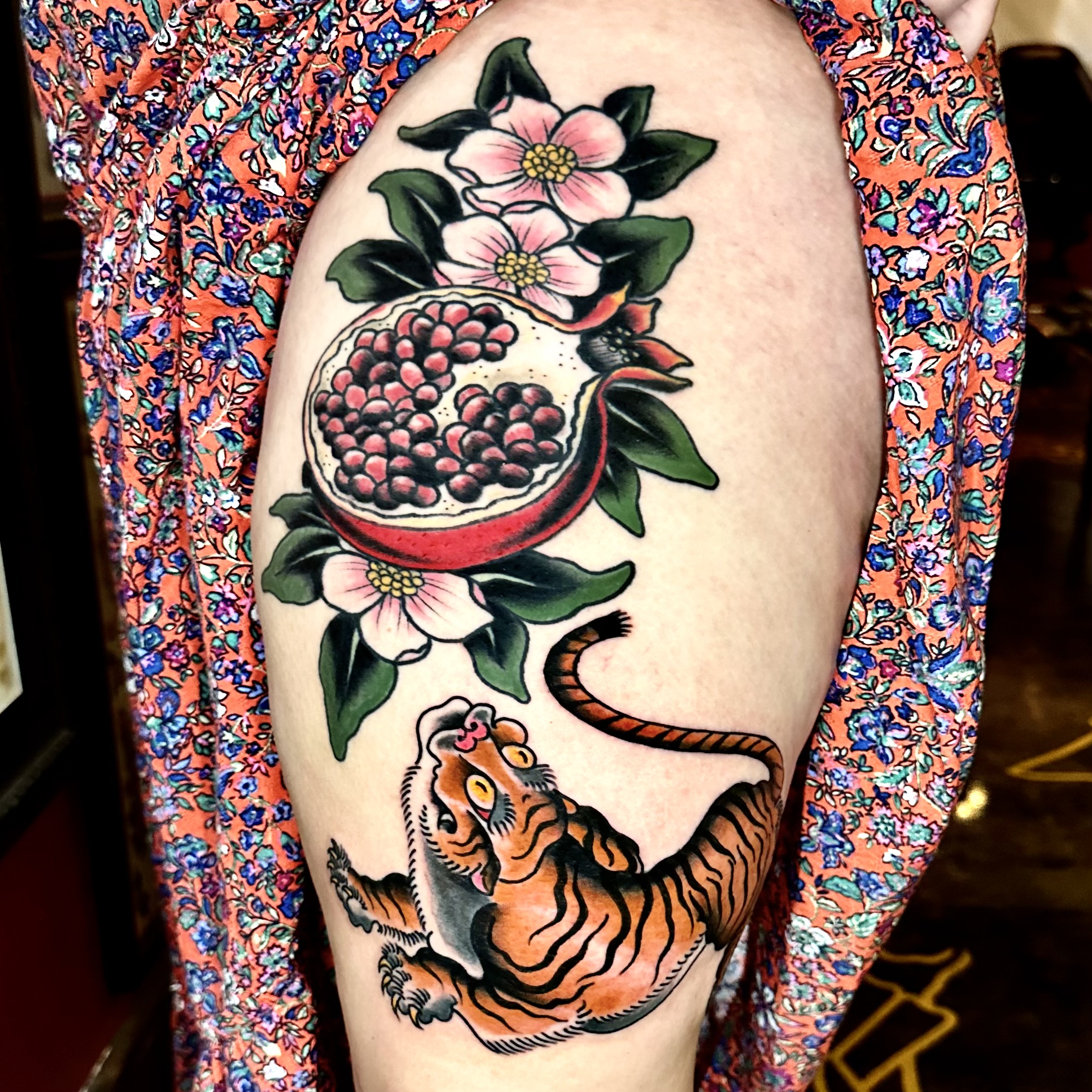 tattoo of a tiger and a pomegranate