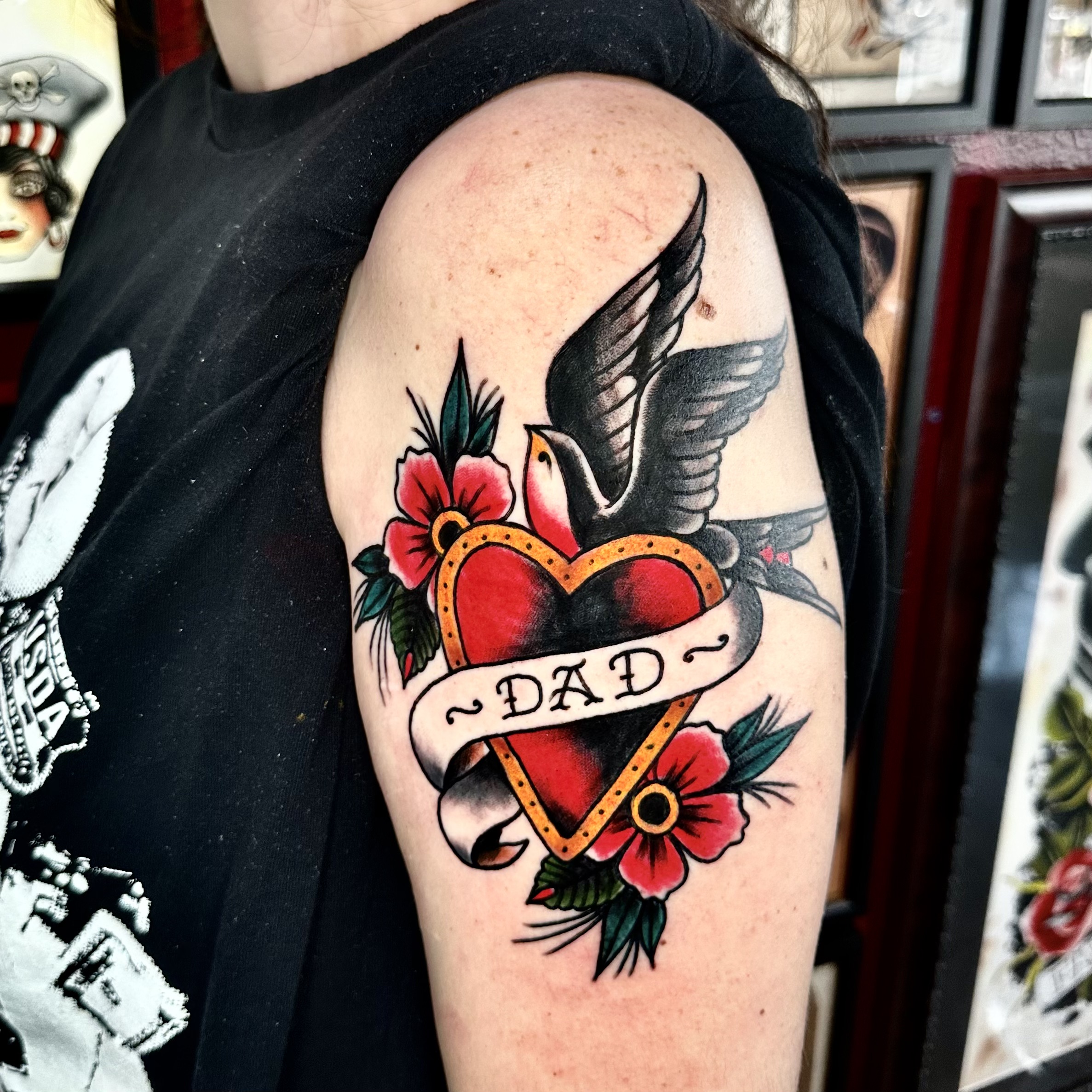 Tattoo of a heart with "dad" on it