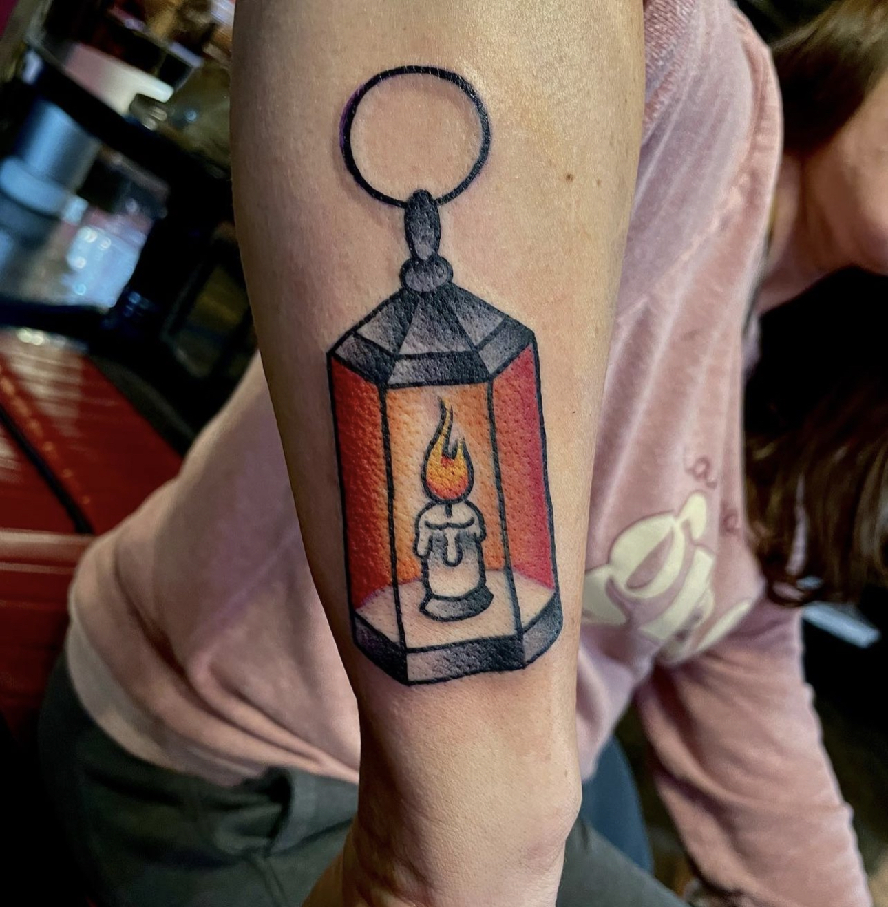 Tattoo of a lit lantern