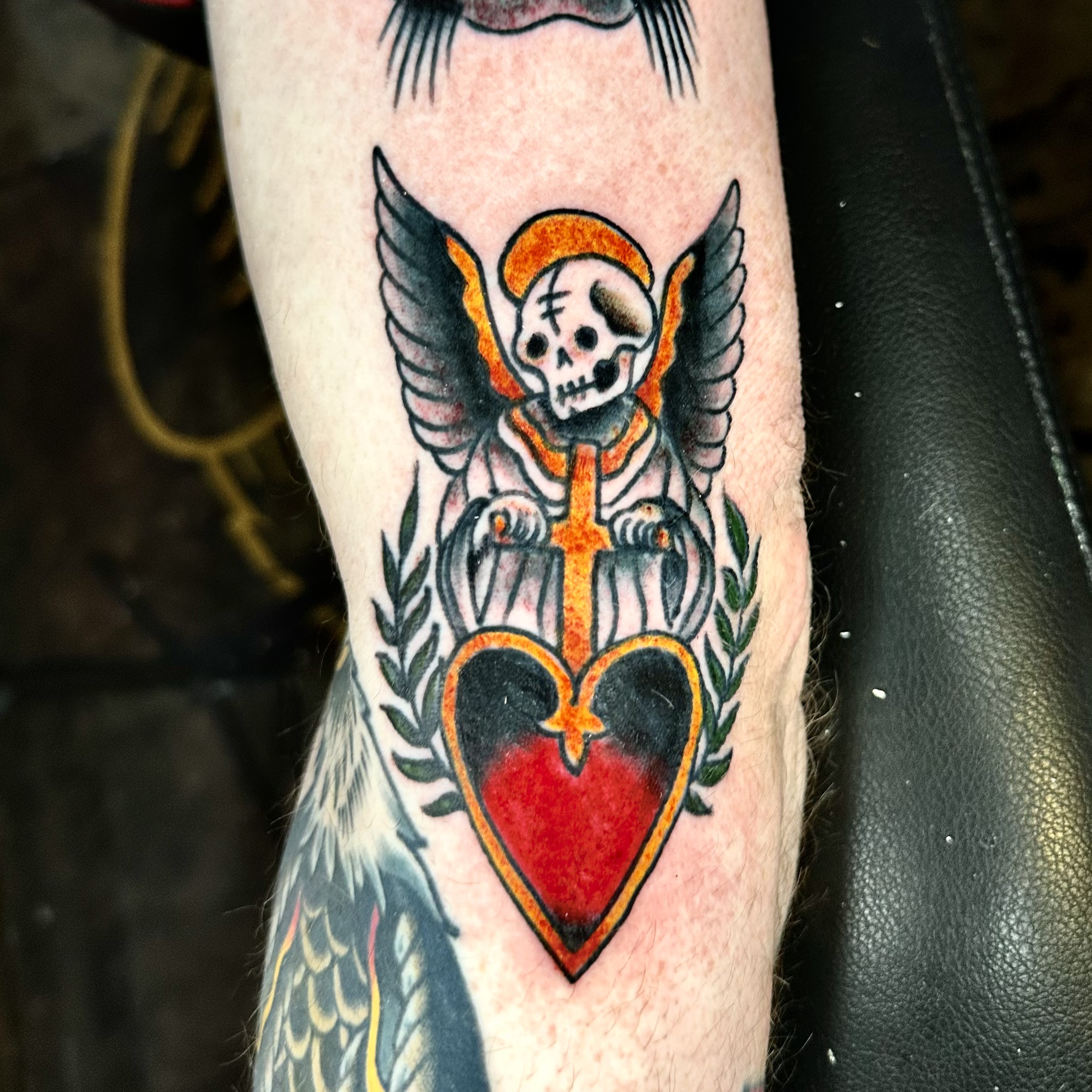 tattoo of a skull, with wings and a heart