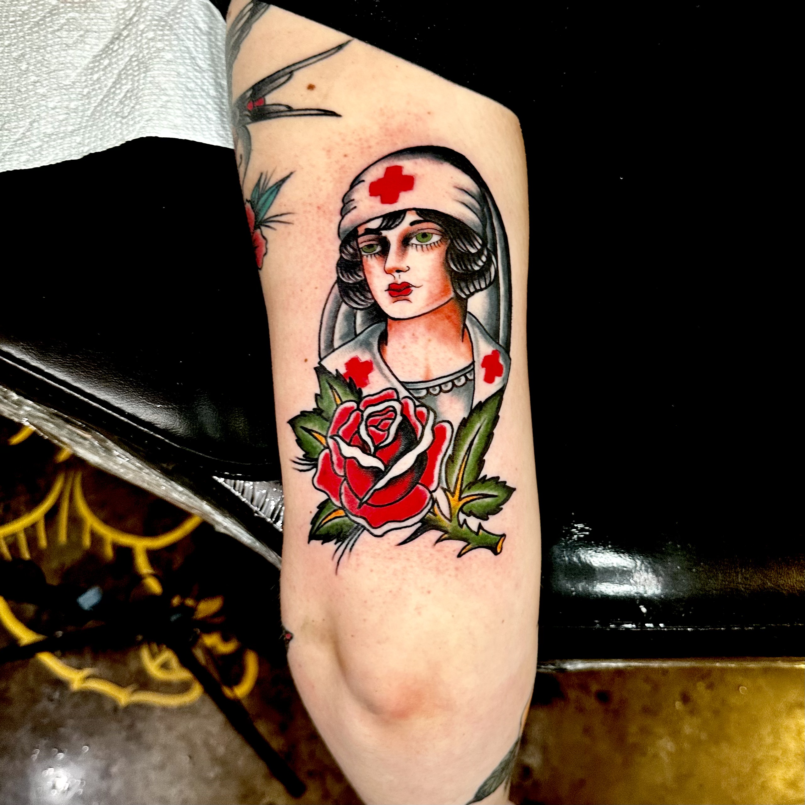 Tattoo of a nurse and a rose