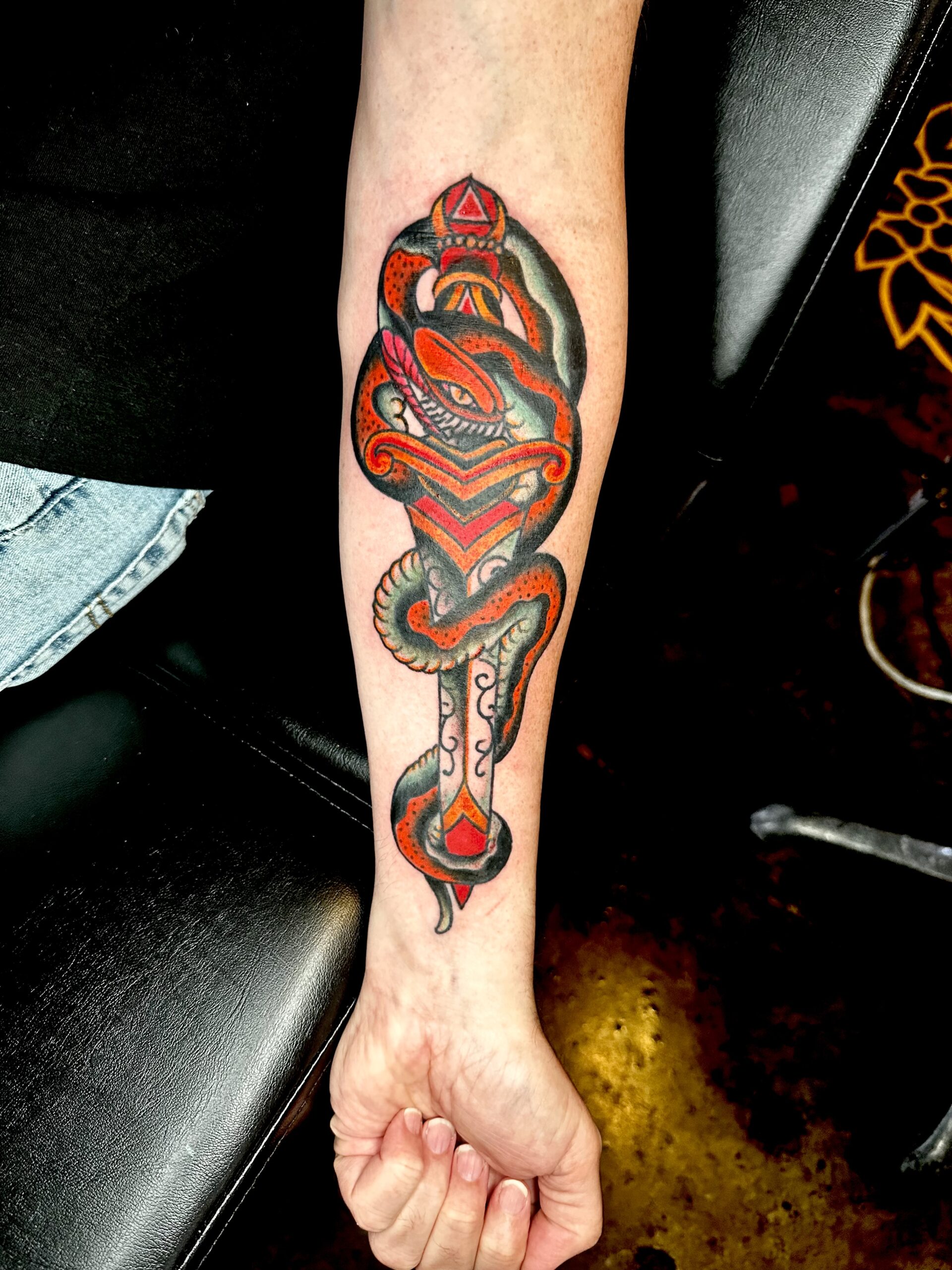tattoo of a snake and a sword