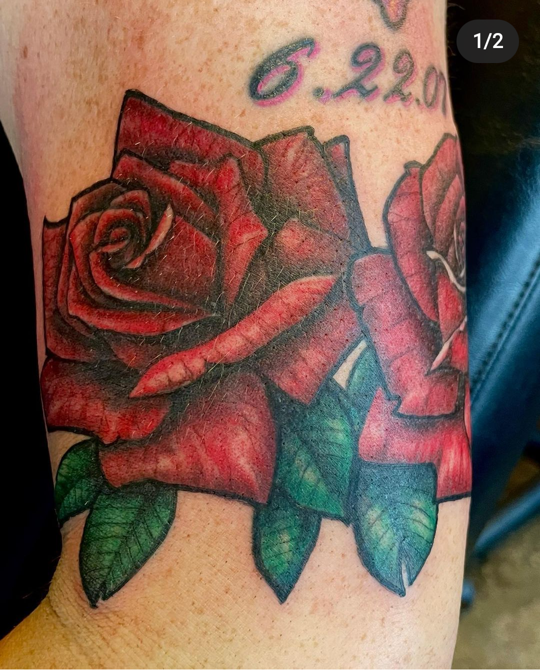 Tattoo of 2 red roses from best tattoo shops in dallas