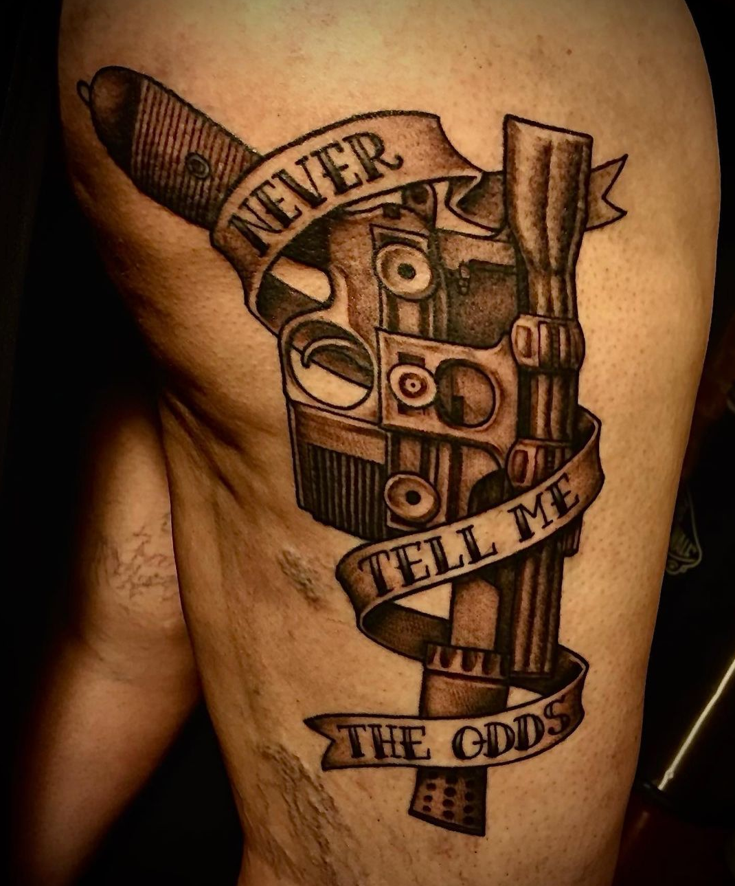 Tattoo of a gun from best tattoo artist in dallas