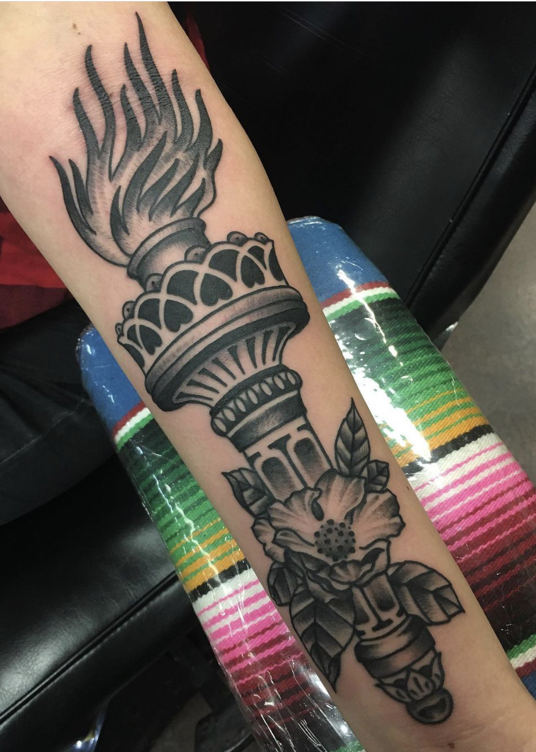 Torch tattoo from shop in Dallas