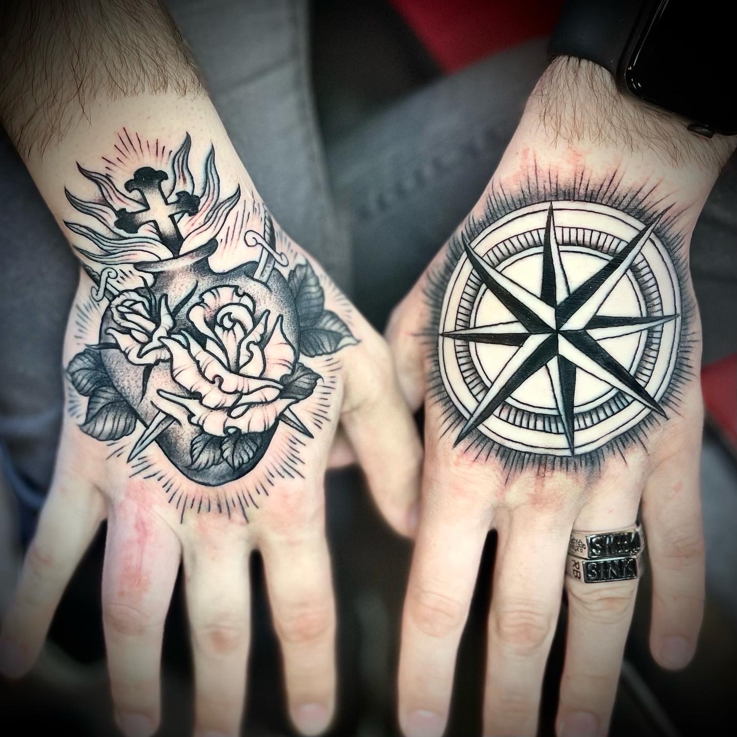 Man with two black ink tattoos on his hands