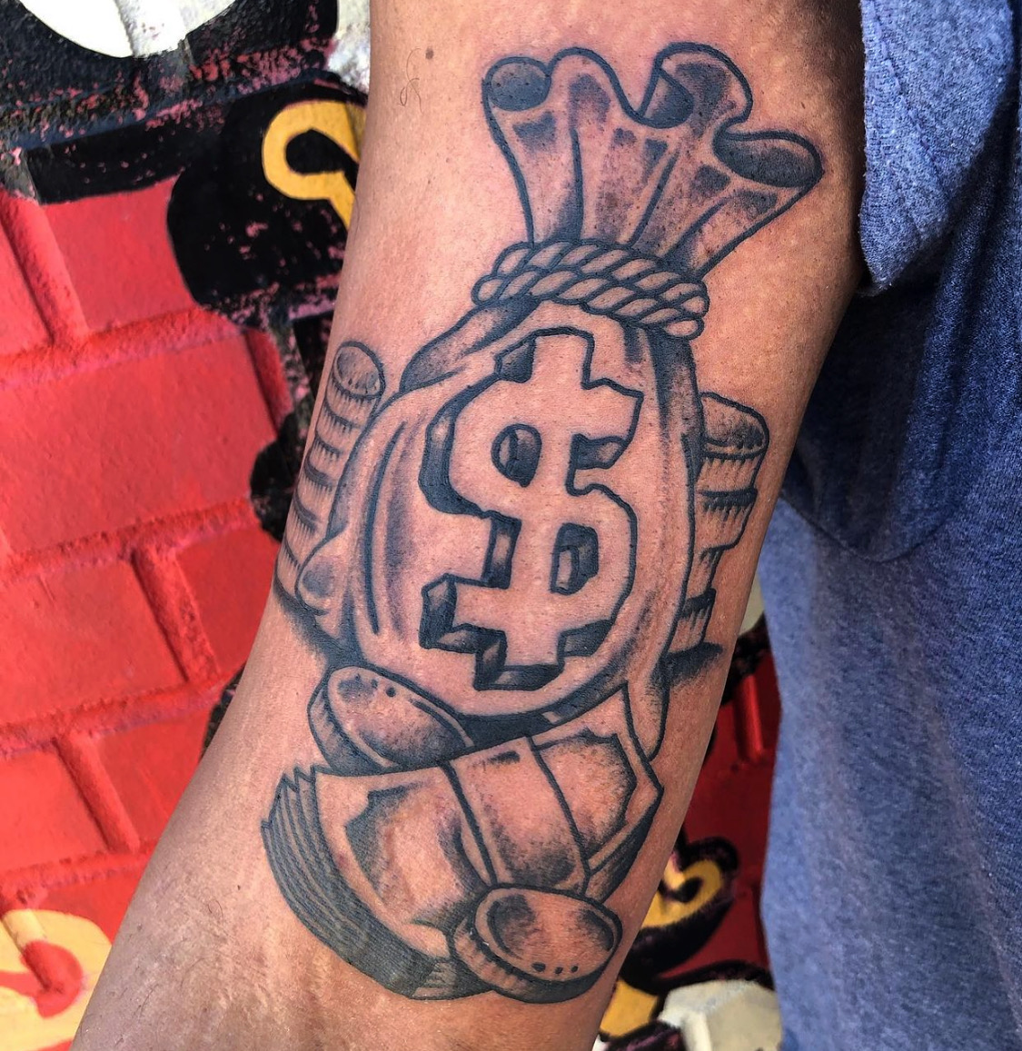 Tattoo of a money bag from top Dallas tattoo artist