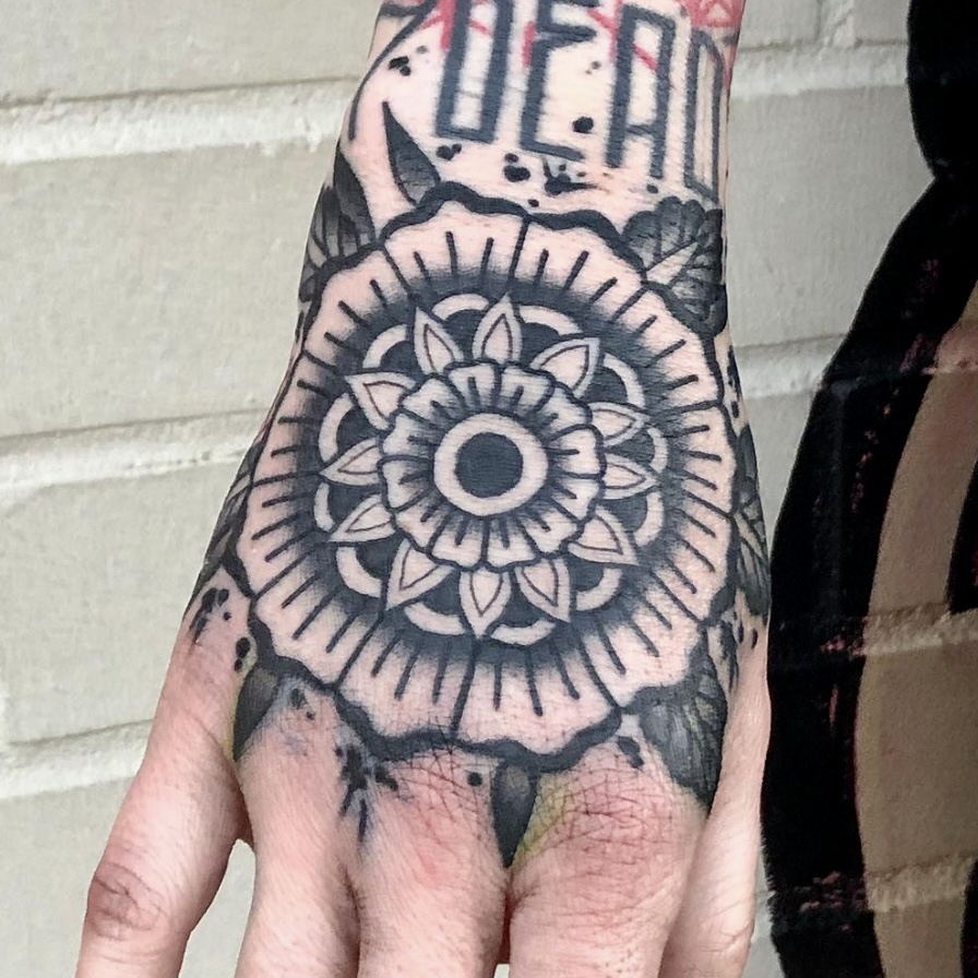 Black and white flower tattoo from best tattoos in dallas