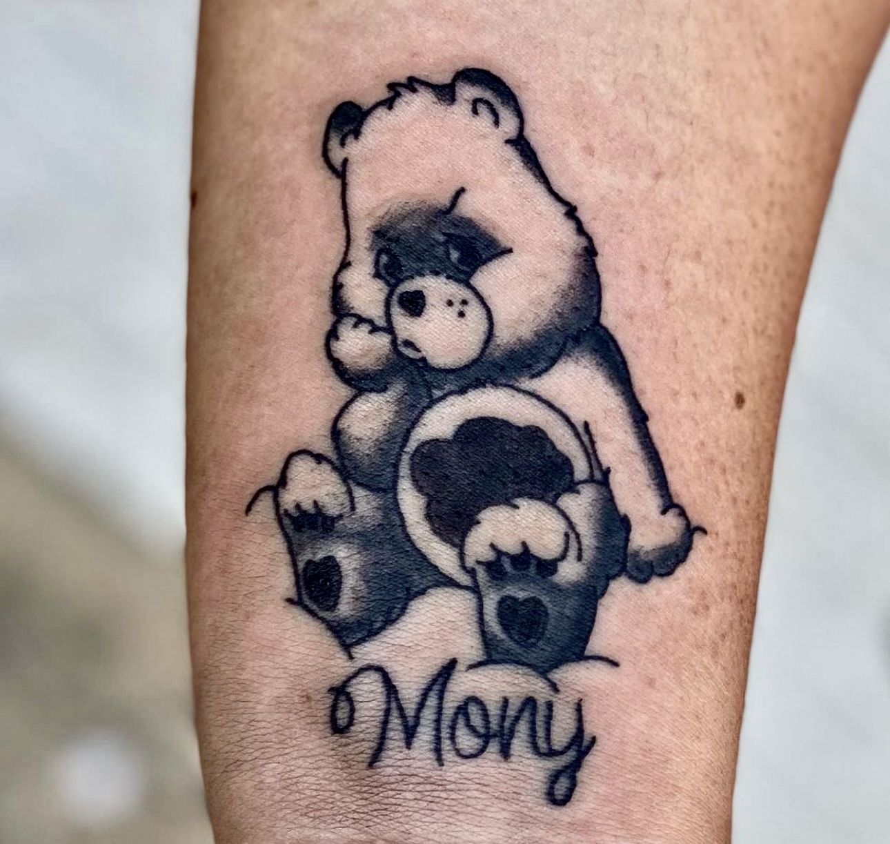 Tattoo of a bear on a man's arm