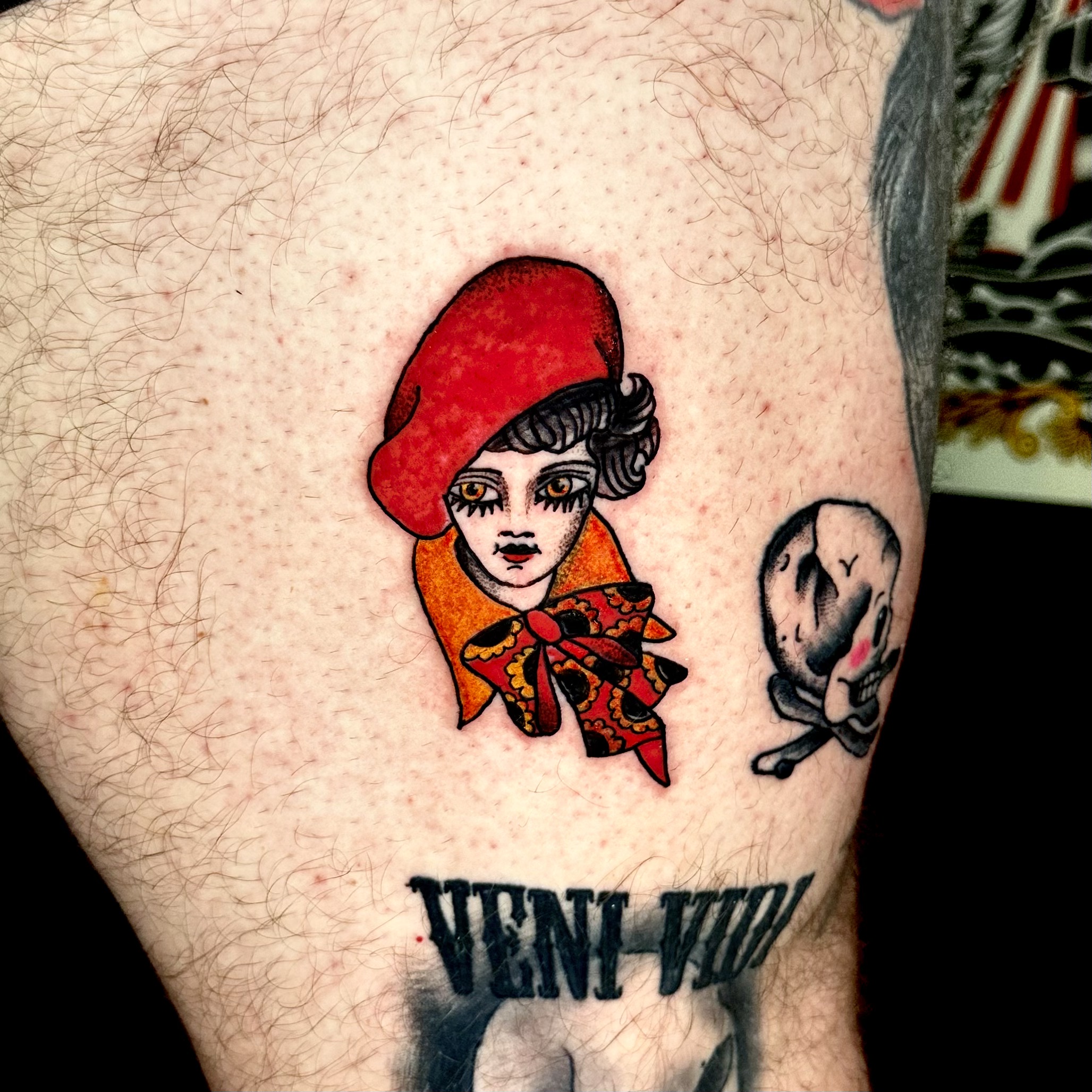 Tattoo of a woman in a red hat