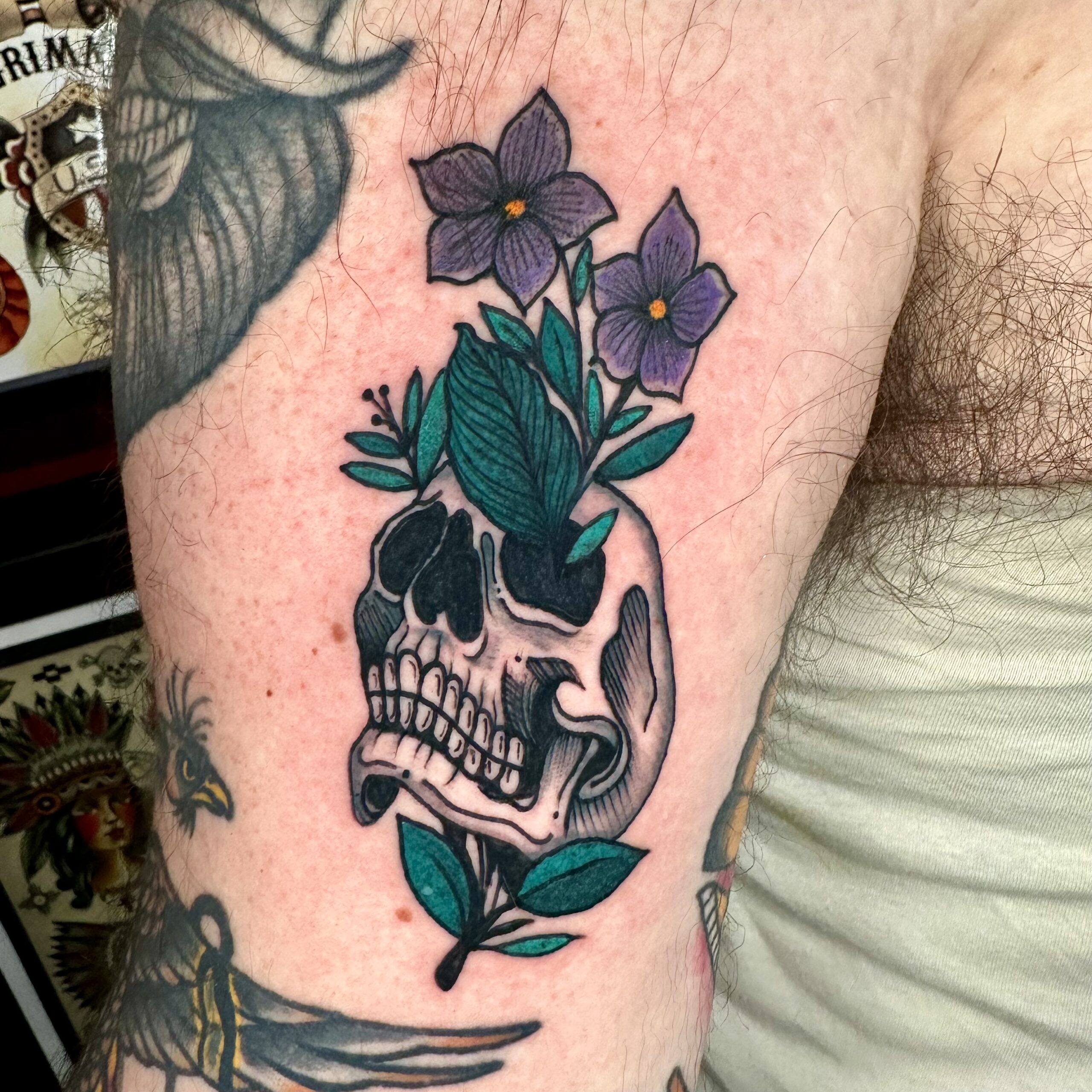 Skull tattoo with flowers