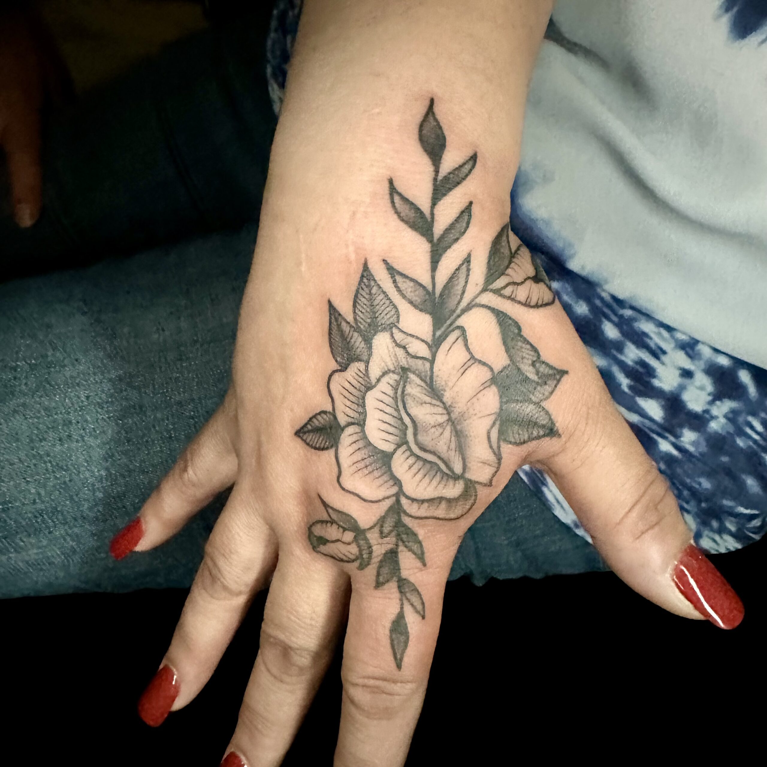 Hand tattoo of a flower